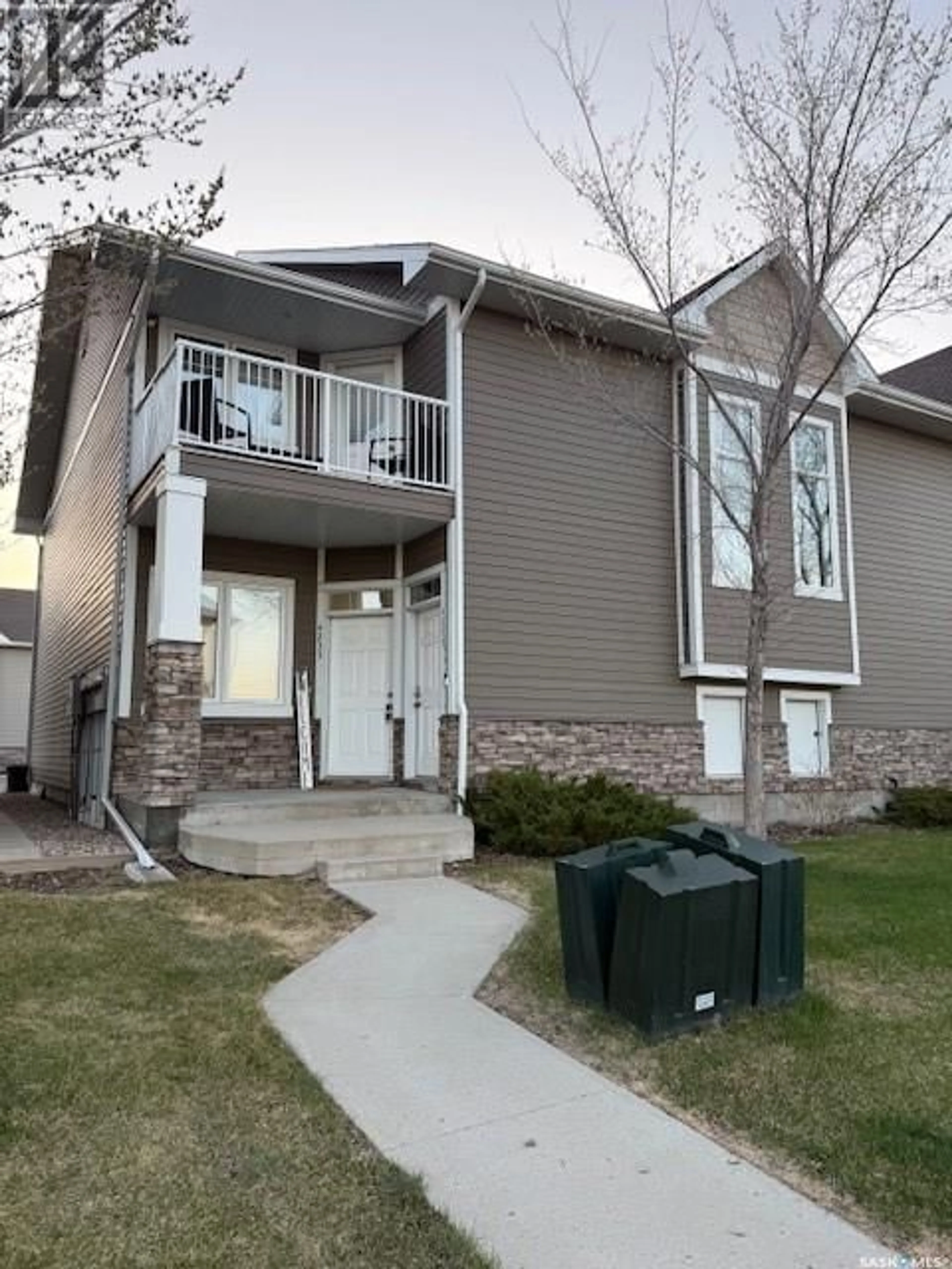 Home with vinyl exterior material, street for E - 4233 GREEN APPLE DRIVE, Regina Saskatchewan S4V1S1