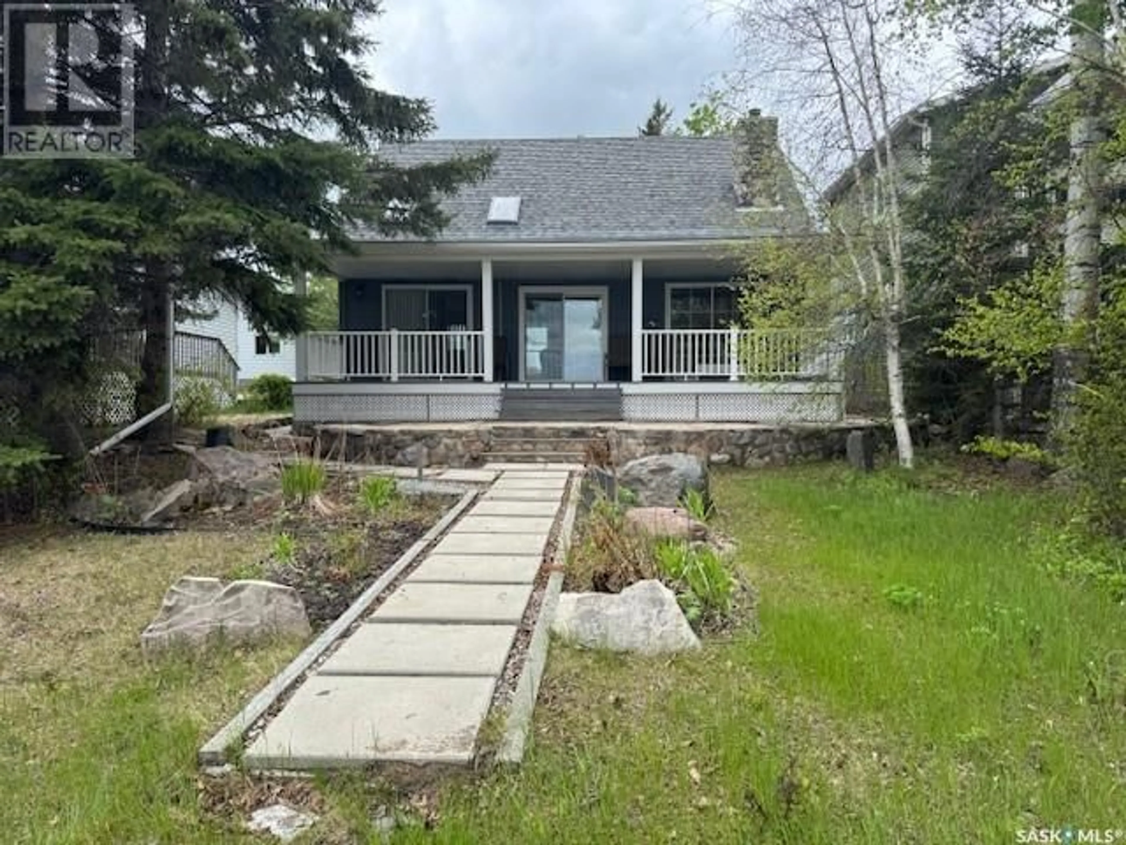 A pic from outside/outdoor area/front of a property/back of a property/a pic from drone, water/lake/river/ocean view for 1735 COTTAGE ROAD, Kopp's Kove Saskatchewan S0M1J0