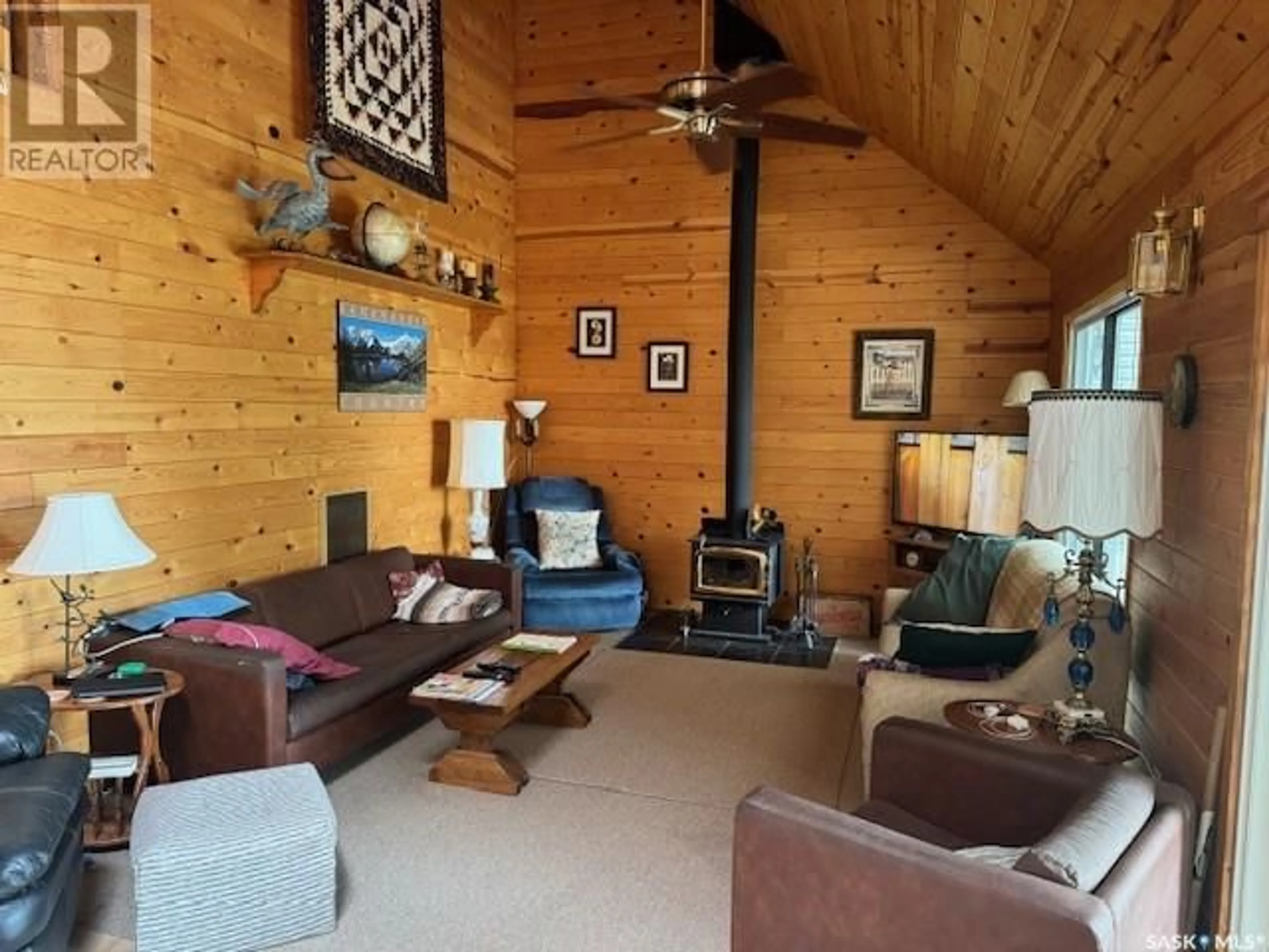 Living room with furniture, wood/laminate floor for 1735 COTTAGE ROAD, Kopp's Kove Saskatchewan S0M1J0