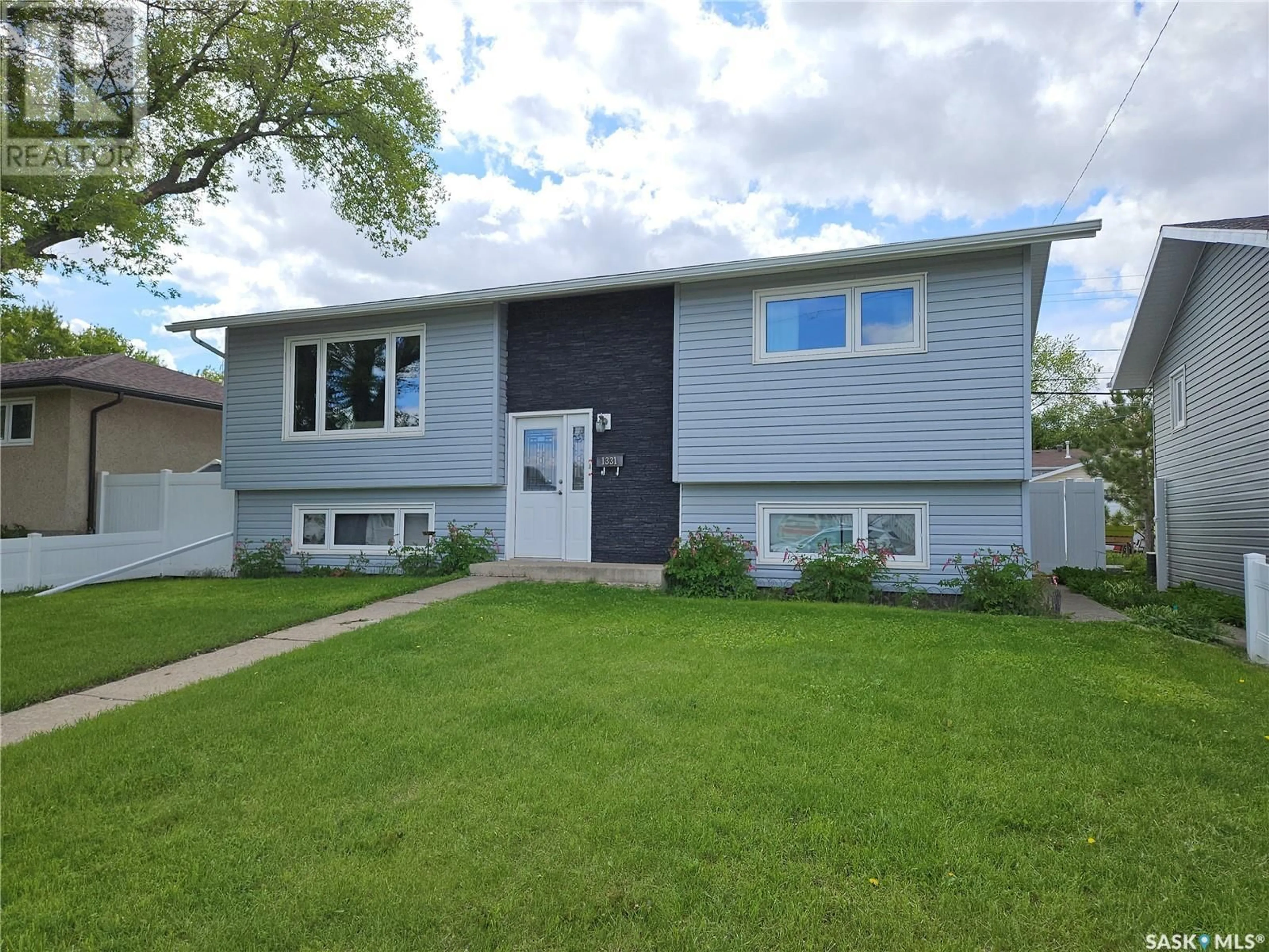 Home with vinyl exterior material, street for 1331 COTEAU STREET, Moose Jaw Saskatchewan S6H5G9