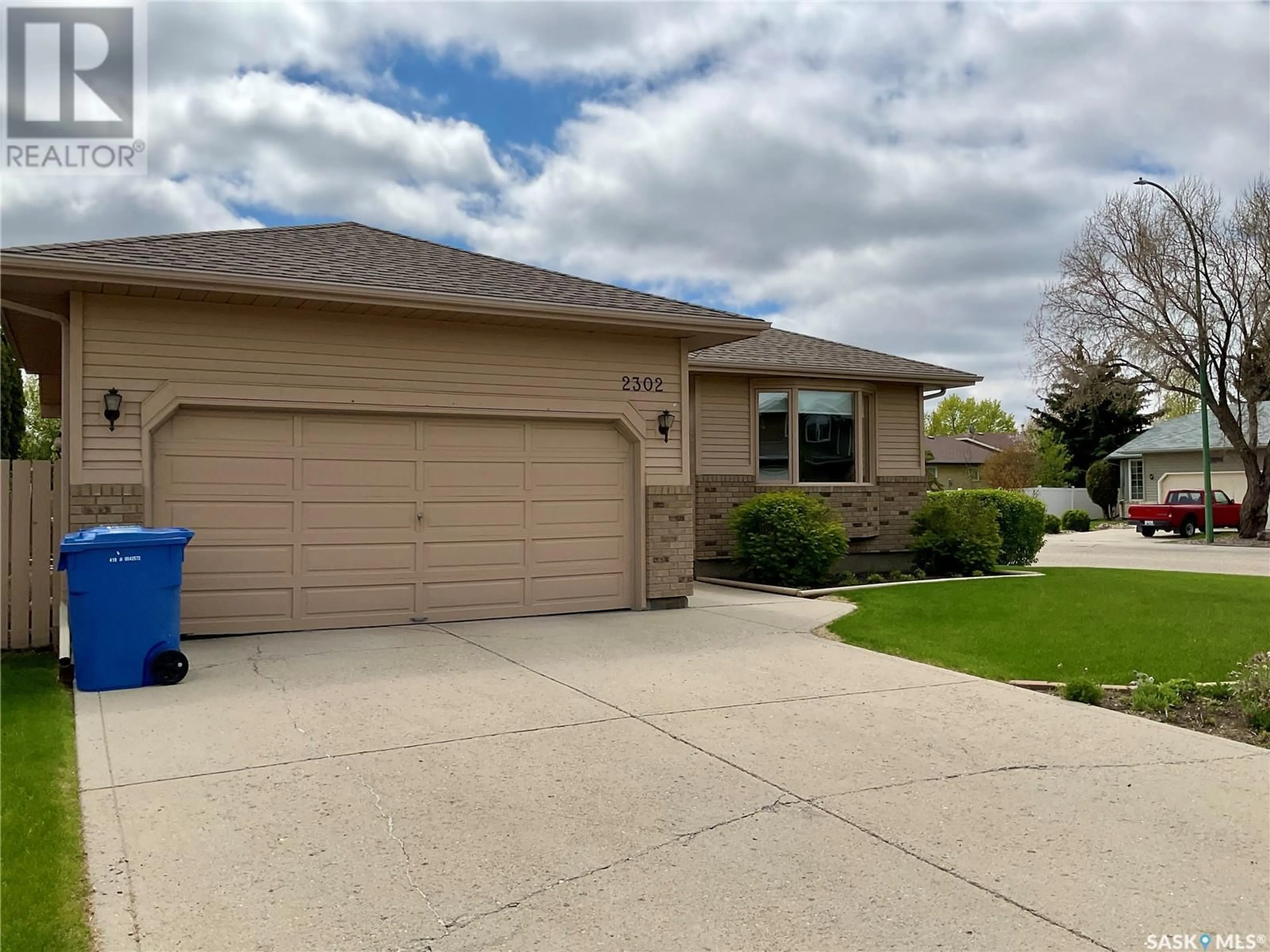 Home with vinyl exterior material, street for 2302 MCLURG CRESCENT, Regina Saskatchewan S4V2N5