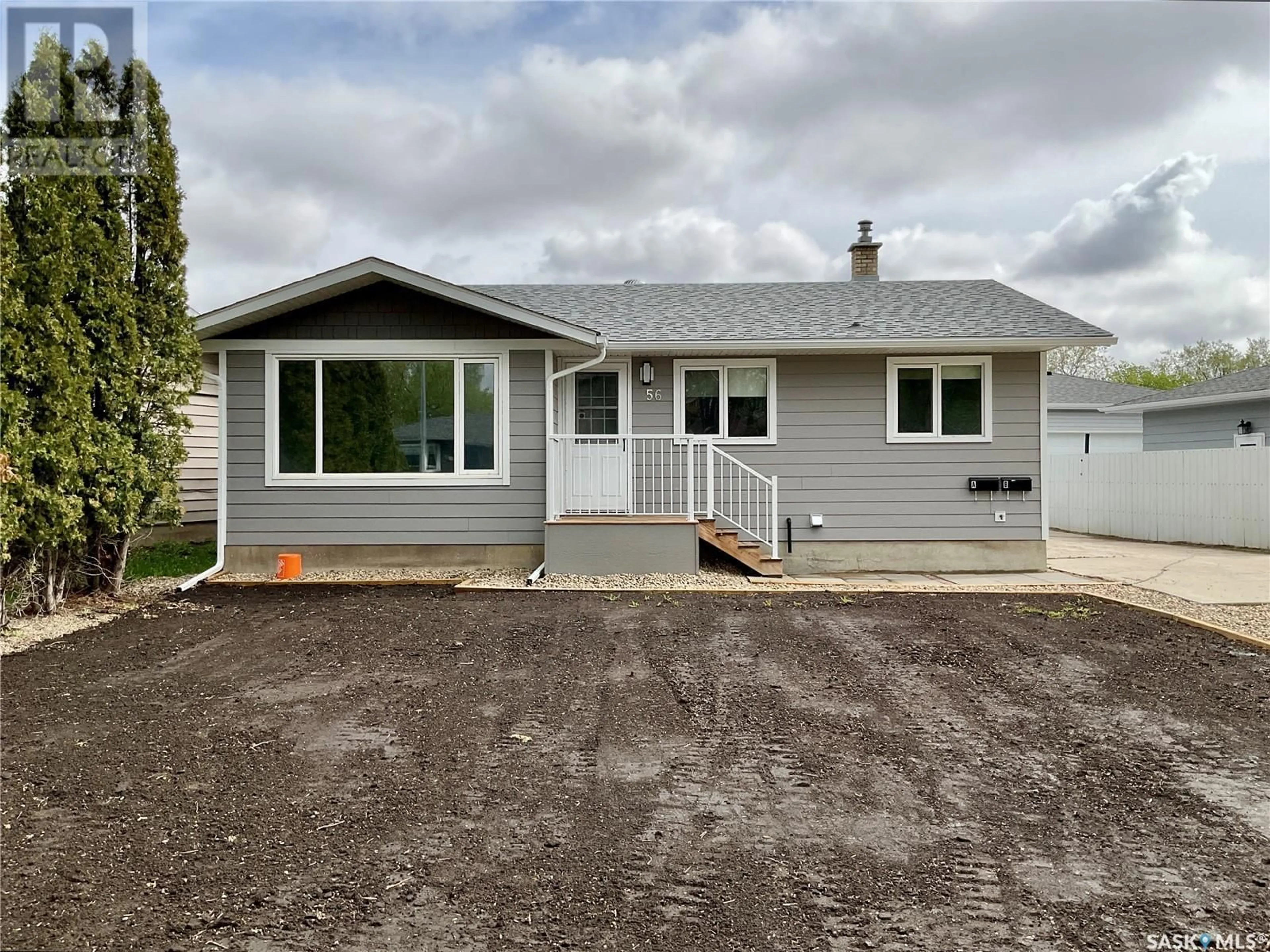 Home with vinyl exterior material, street for 56 UPLAND DRIVE, Regina Saskatchewan S4R0B9