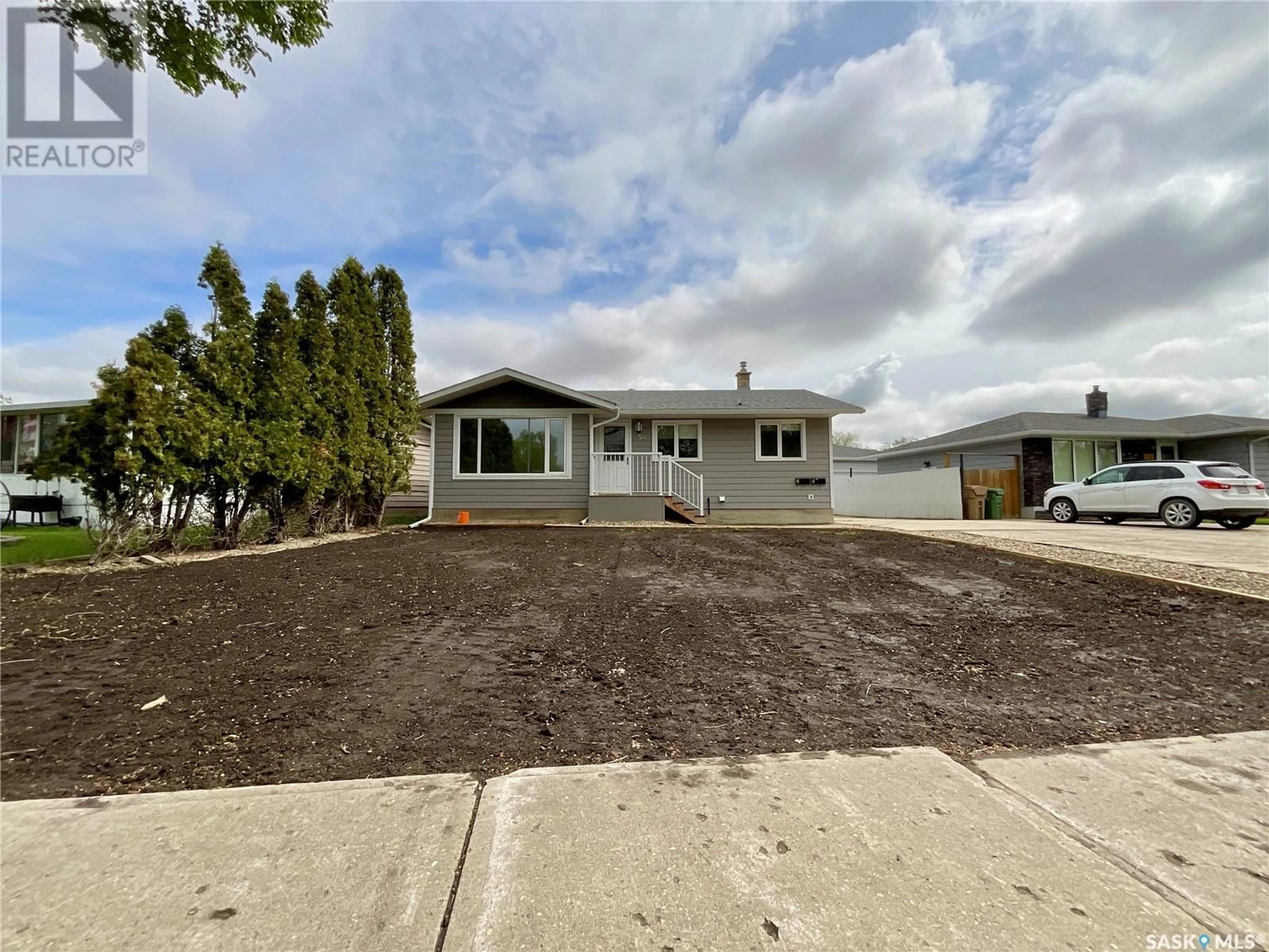 Home with vinyl exterior material, street for 56 UPLAND DRIVE, Regina Saskatchewan S4R0B9