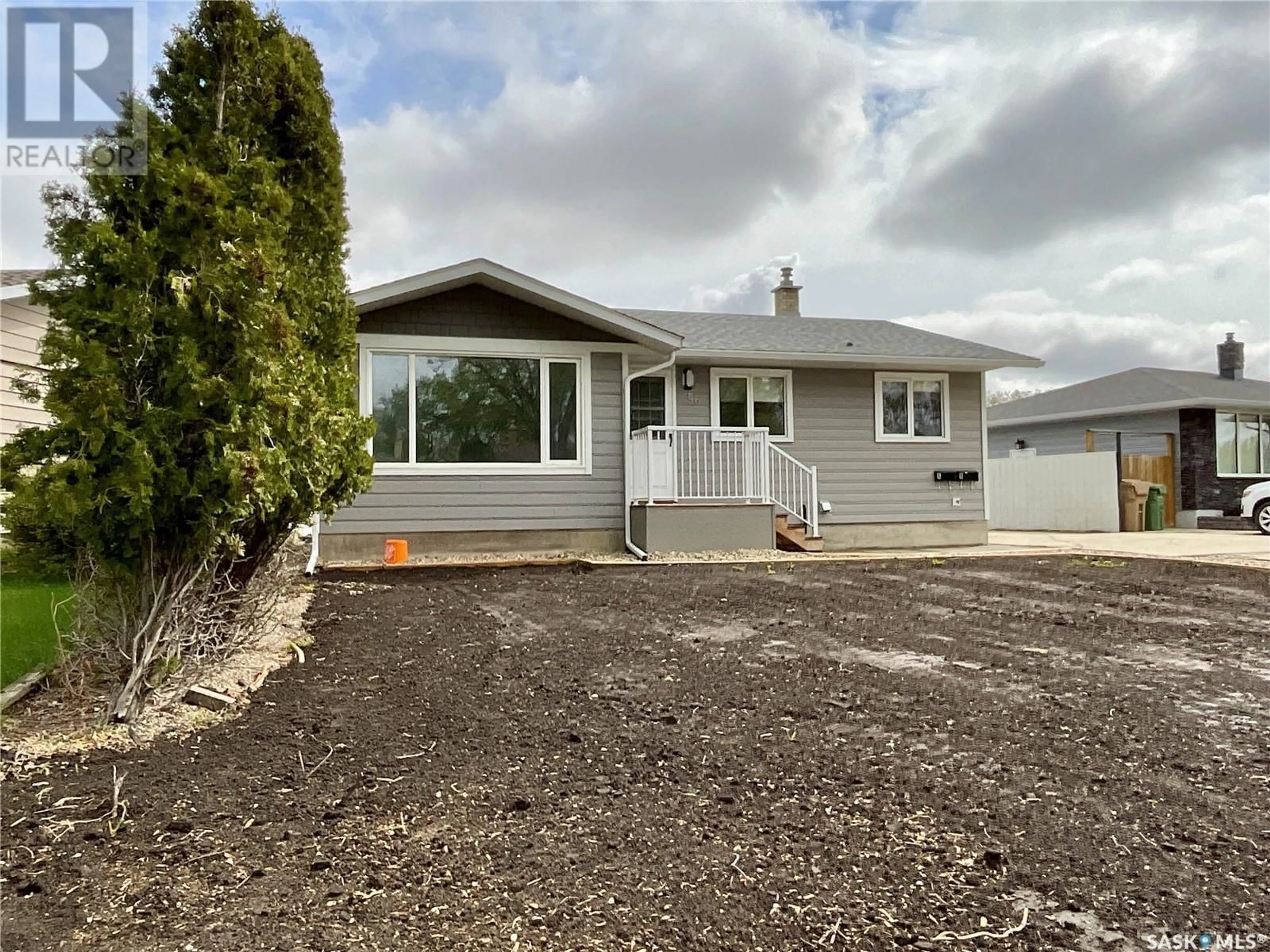 Home with vinyl exterior material, street for 56 UPLAND DRIVE, Regina Saskatchewan S4R0B9