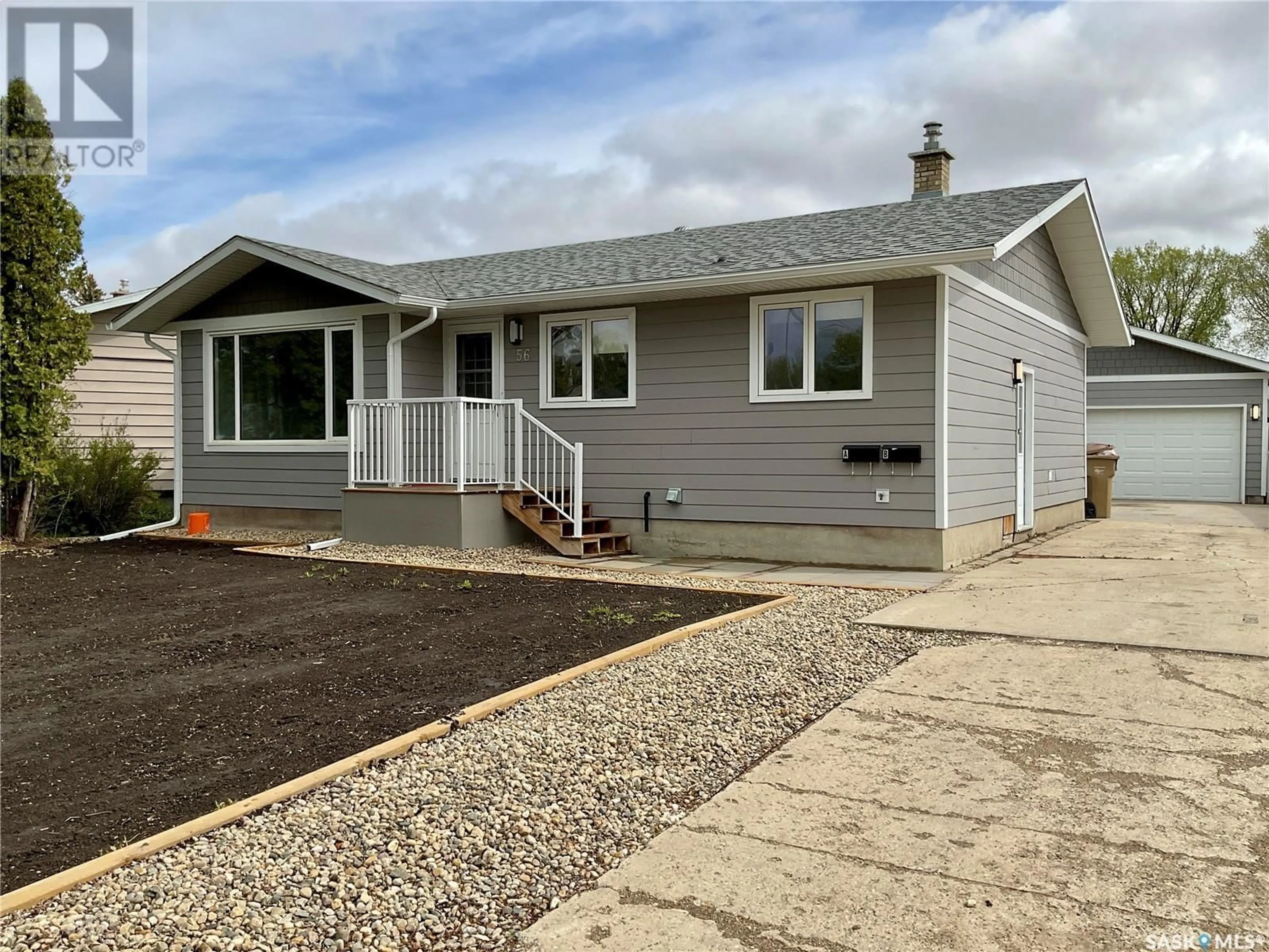 Home with vinyl exterior material, street for 56 UPLAND DRIVE, Regina Saskatchewan S4R0B9