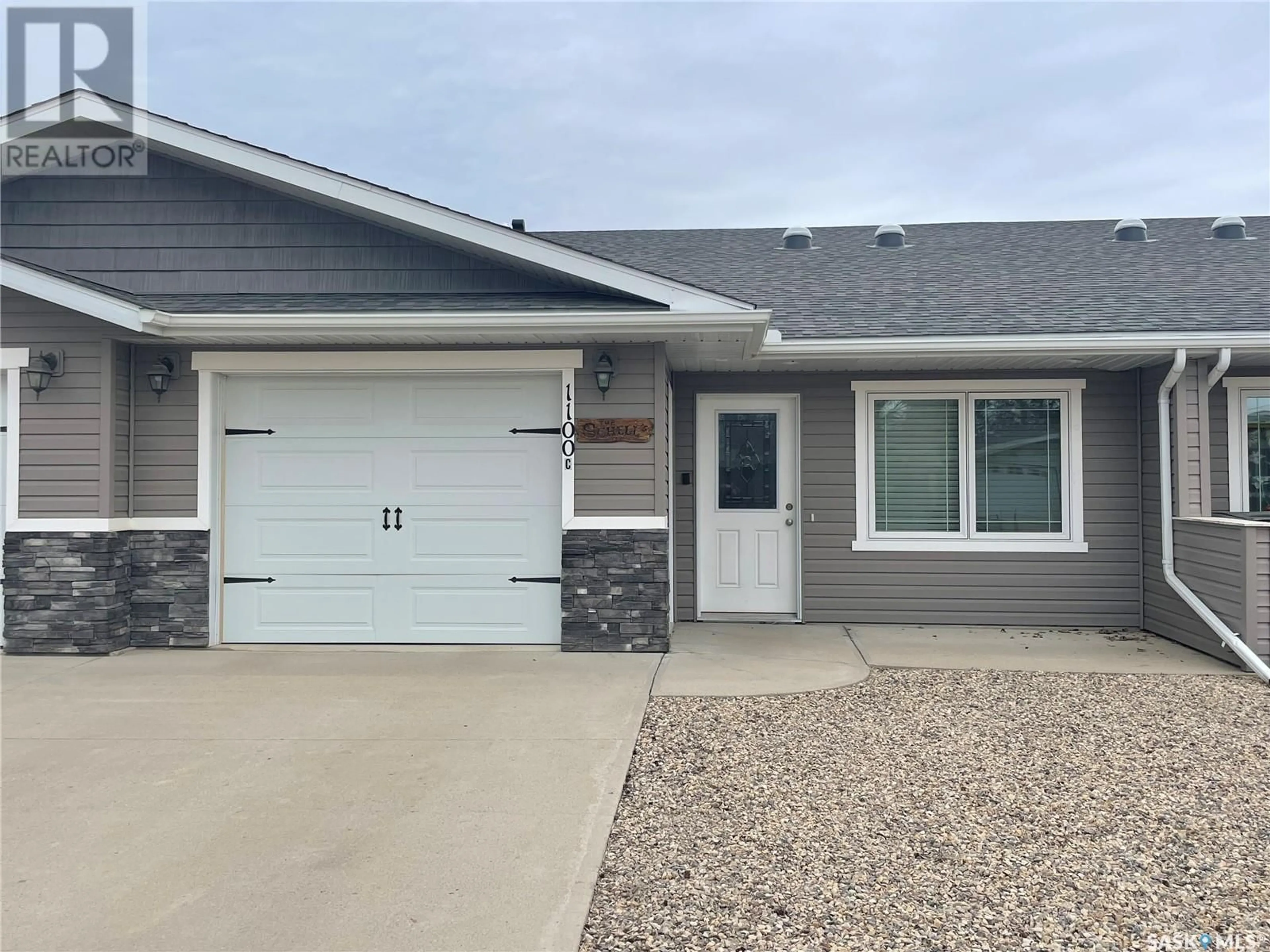 Home with vinyl exterior material, street for C - 1100 95TH AVENUE, Tisdale Saskatchewan S0E1T0