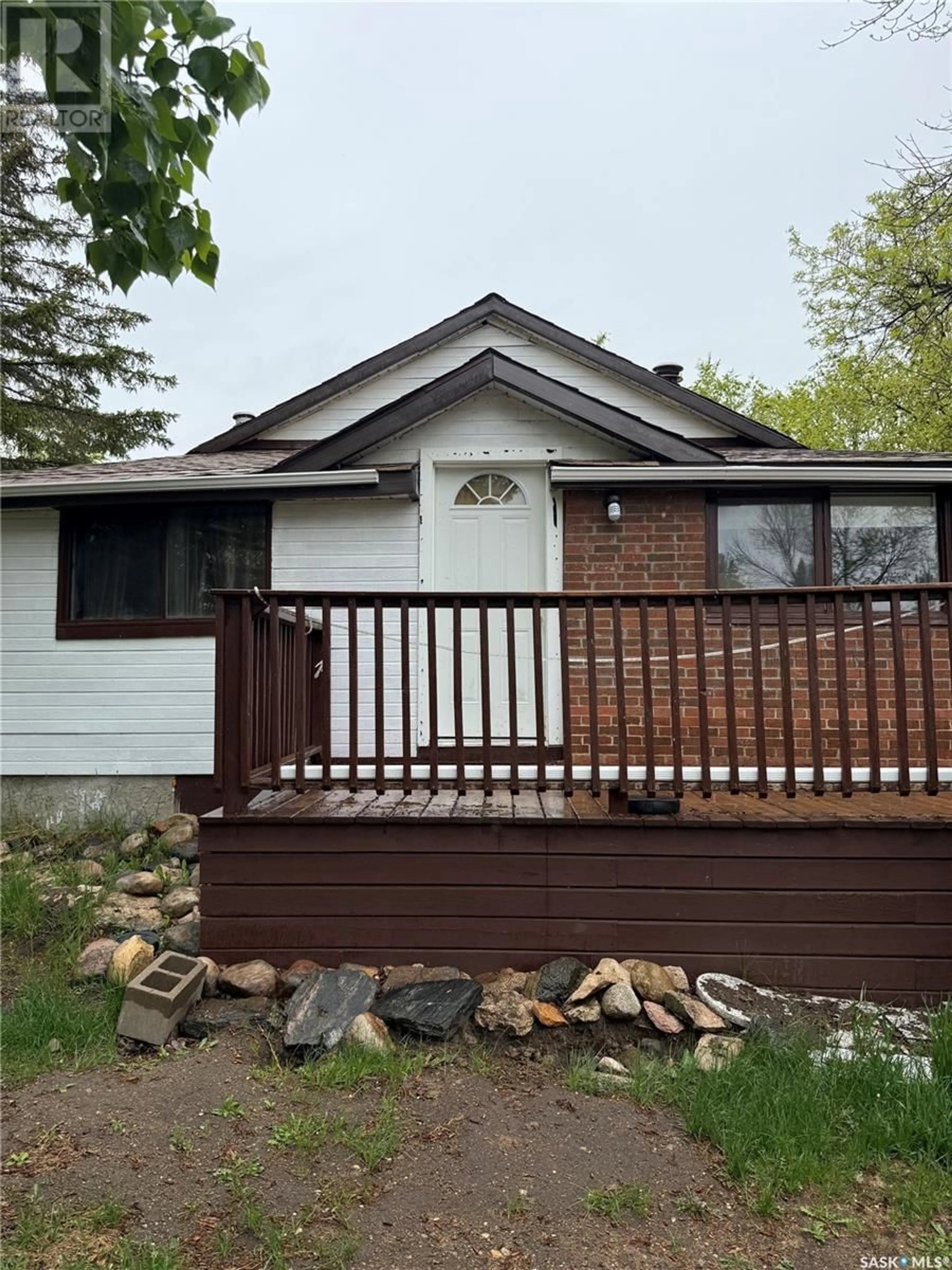 Home with vinyl exterior material, street for 234 MACMURCHY AVENUE, Regina Beach Saskatchewan S0G4C0