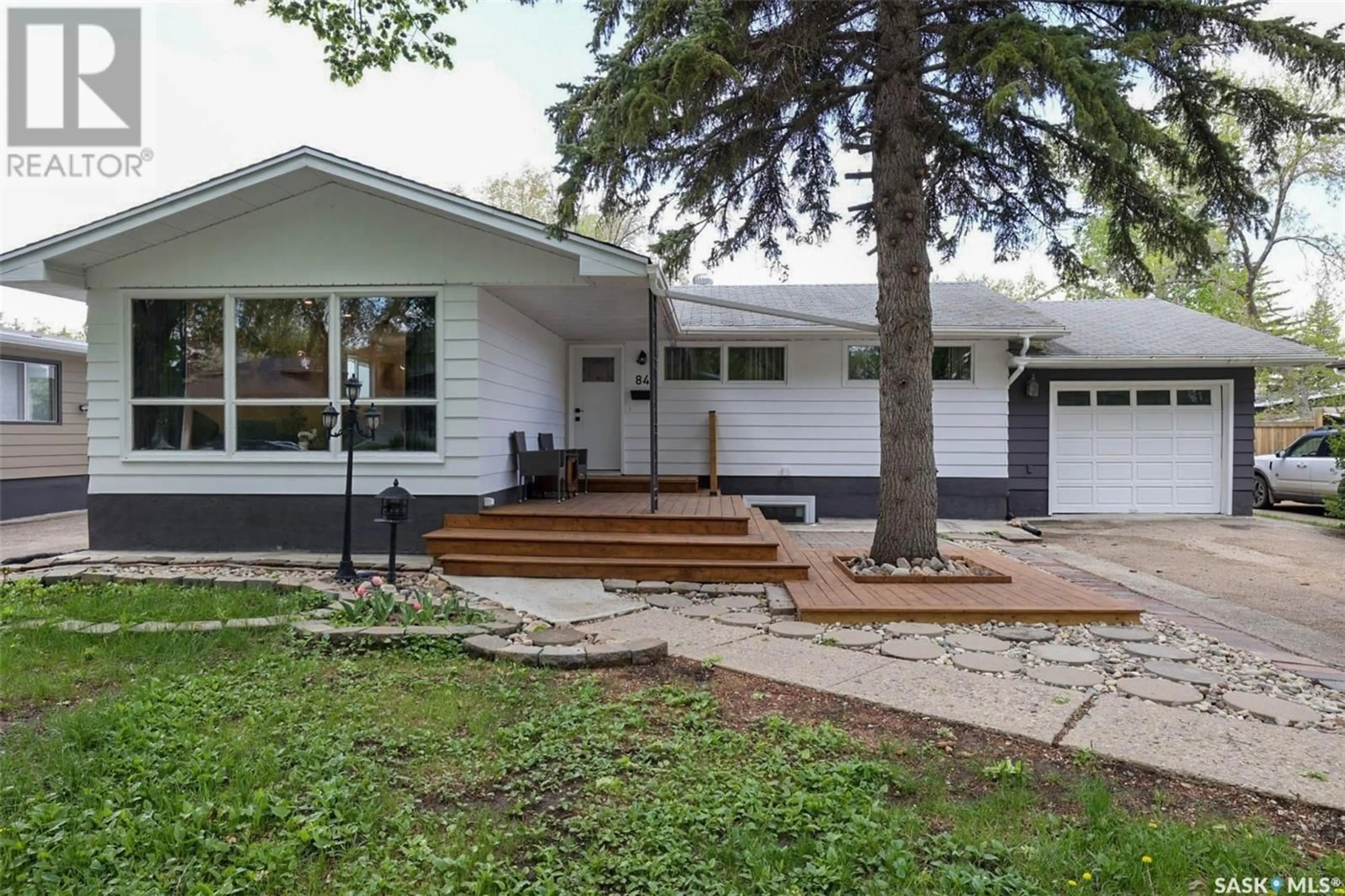 Home with vinyl exterior material, street for 84 BELL STREET, Regina Saskatchewan S4S4B9