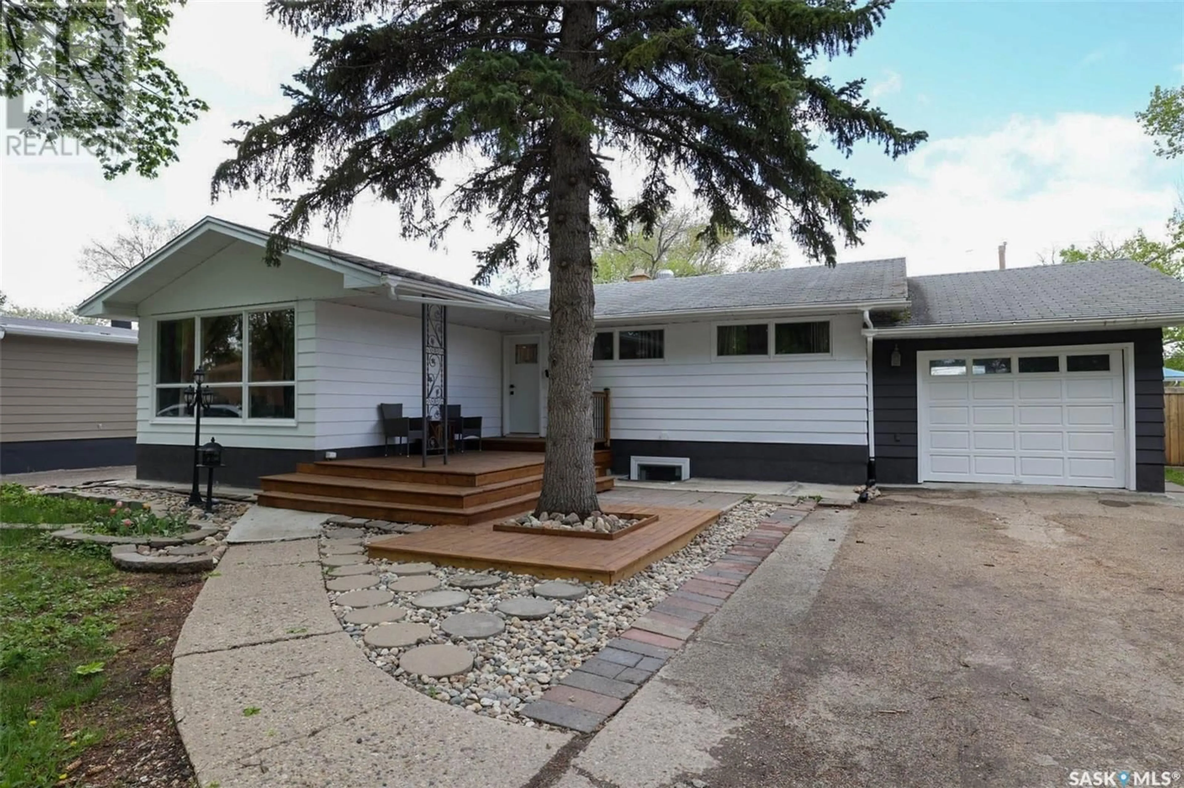Home with vinyl exterior material, street for 84 BELL STREET, Regina Saskatchewan S4S4B9