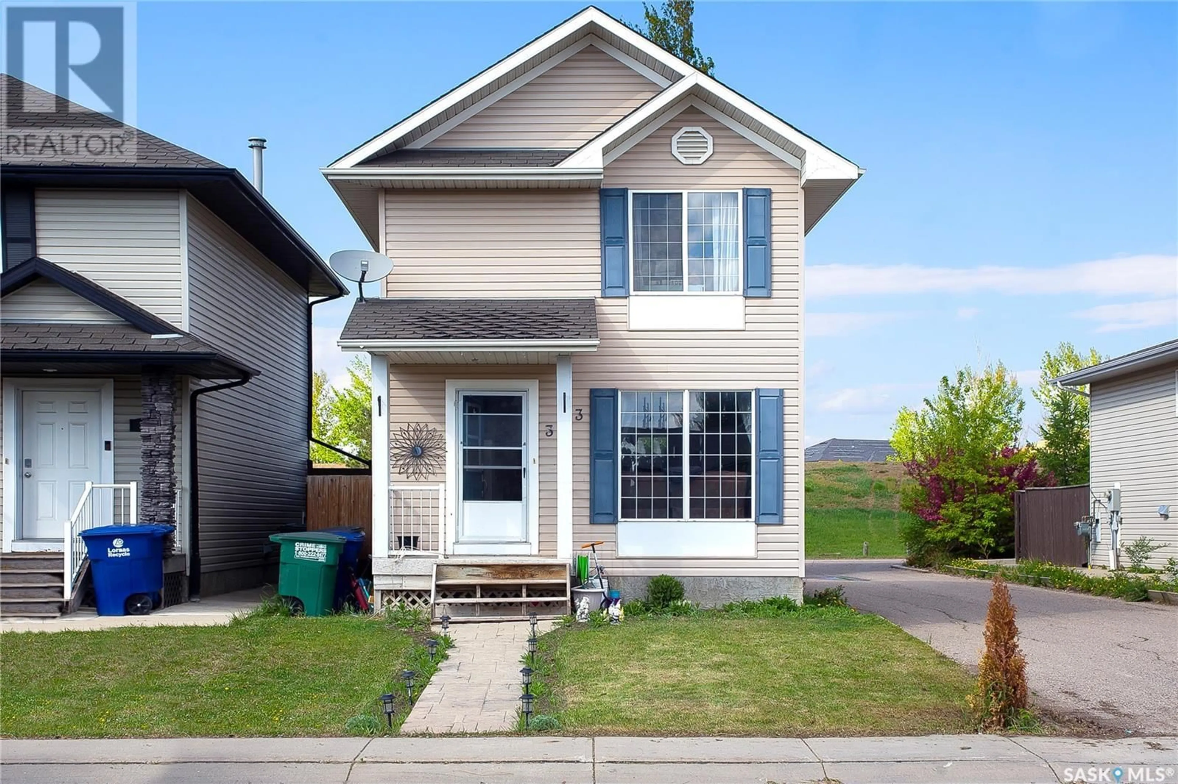 Home with vinyl exterior material, street for 303 RUTHERFORD CRESCENT, Saskatoon Saskatchewan S7N4X5