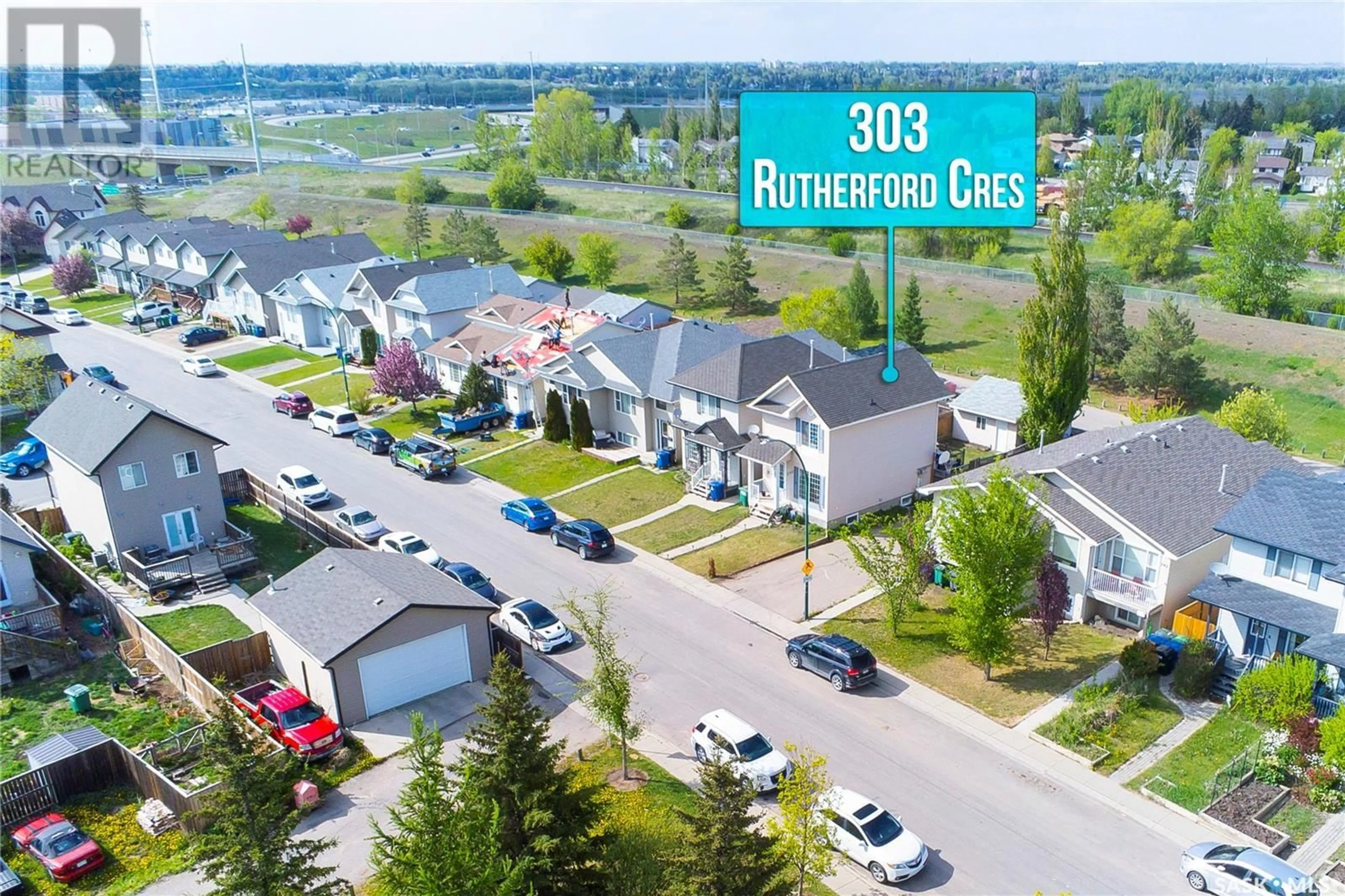 A pic from outside/outdoor area/front of a property/back of a property/a pic from drone, street for 303 RUTHERFORD CRESCENT, Saskatoon Saskatchewan S7N4X5