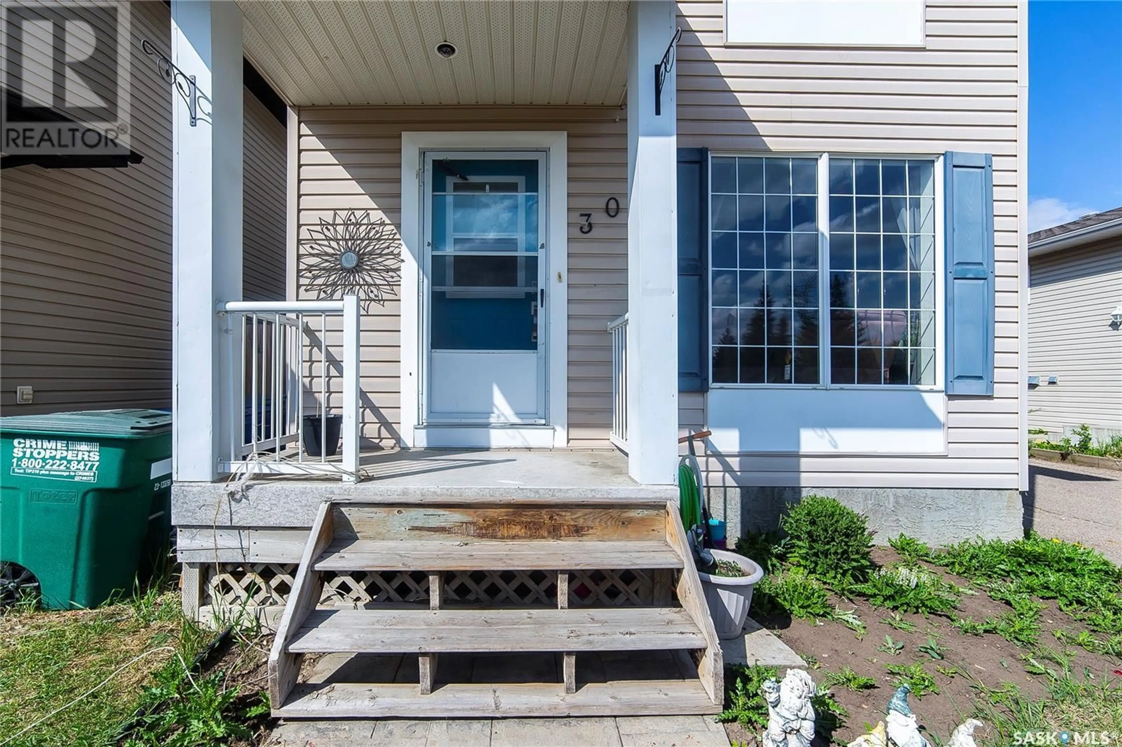 Home with vinyl exterior material, street for 303 RUTHERFORD CRESCENT, Saskatoon Saskatchewan S7N4X5