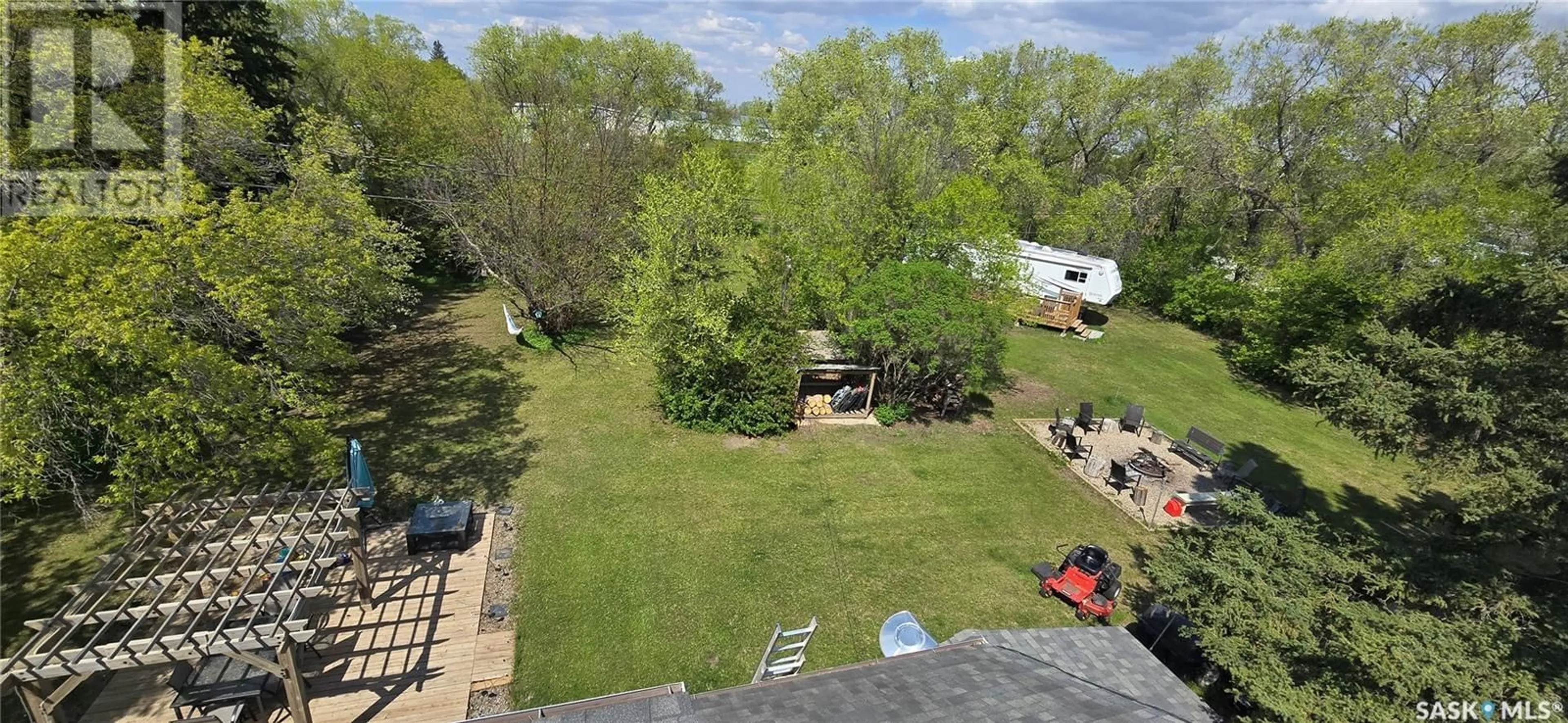 A pic from outside/outdoor area/front of a property/back of a property/a pic from drone, forest/trees view for 308 NORREYS STREET, Drake Saskatchewan S0K1H0