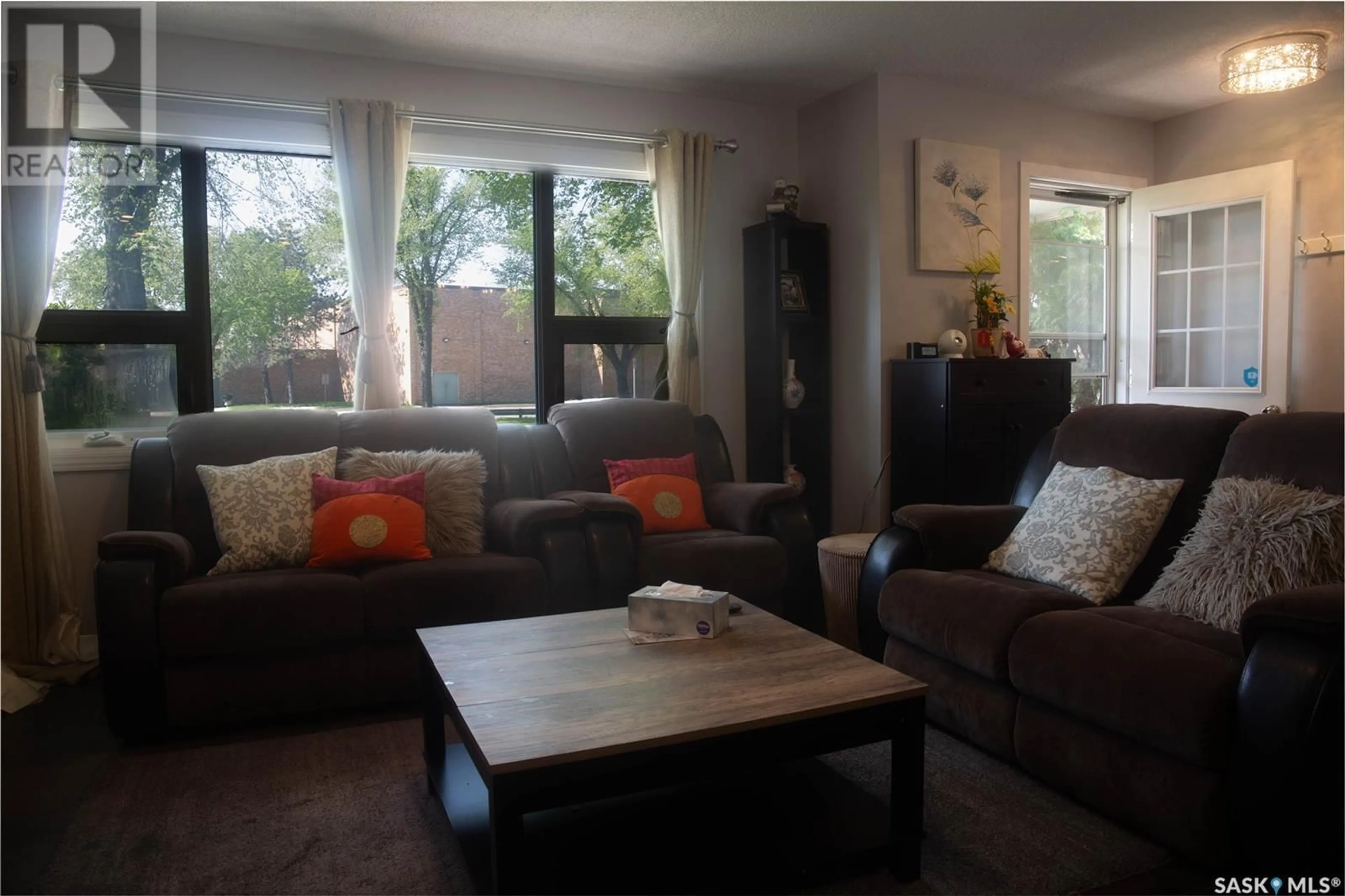 Living room with furniture, wood/laminate floor for 2305 TAYLOR STREET, Saskatoon Saskatchewan S7H1W8
