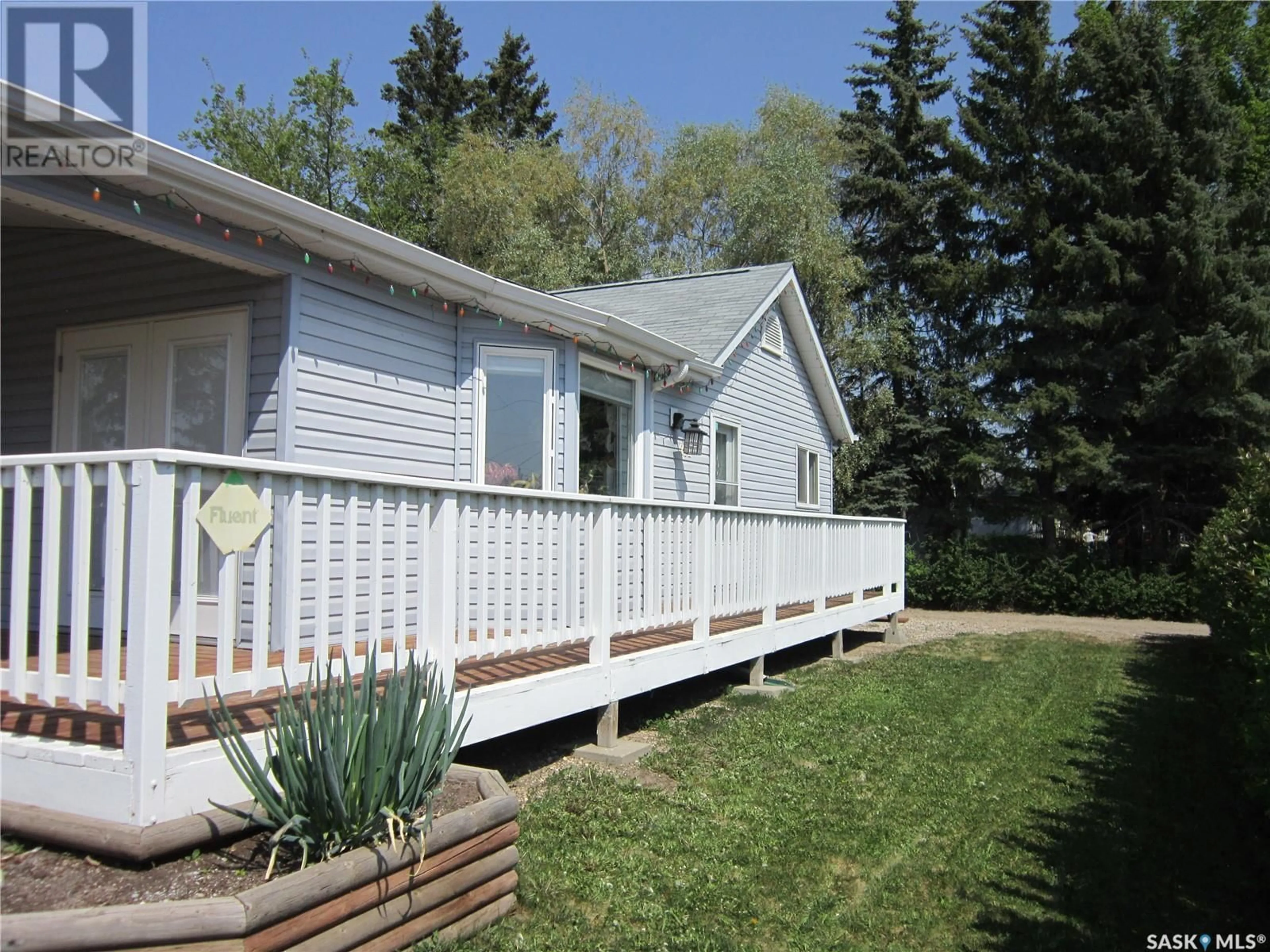 Home with vinyl exterior material, street for 212 2ND STREET, Wakaw Saskatchewan S0K4P0