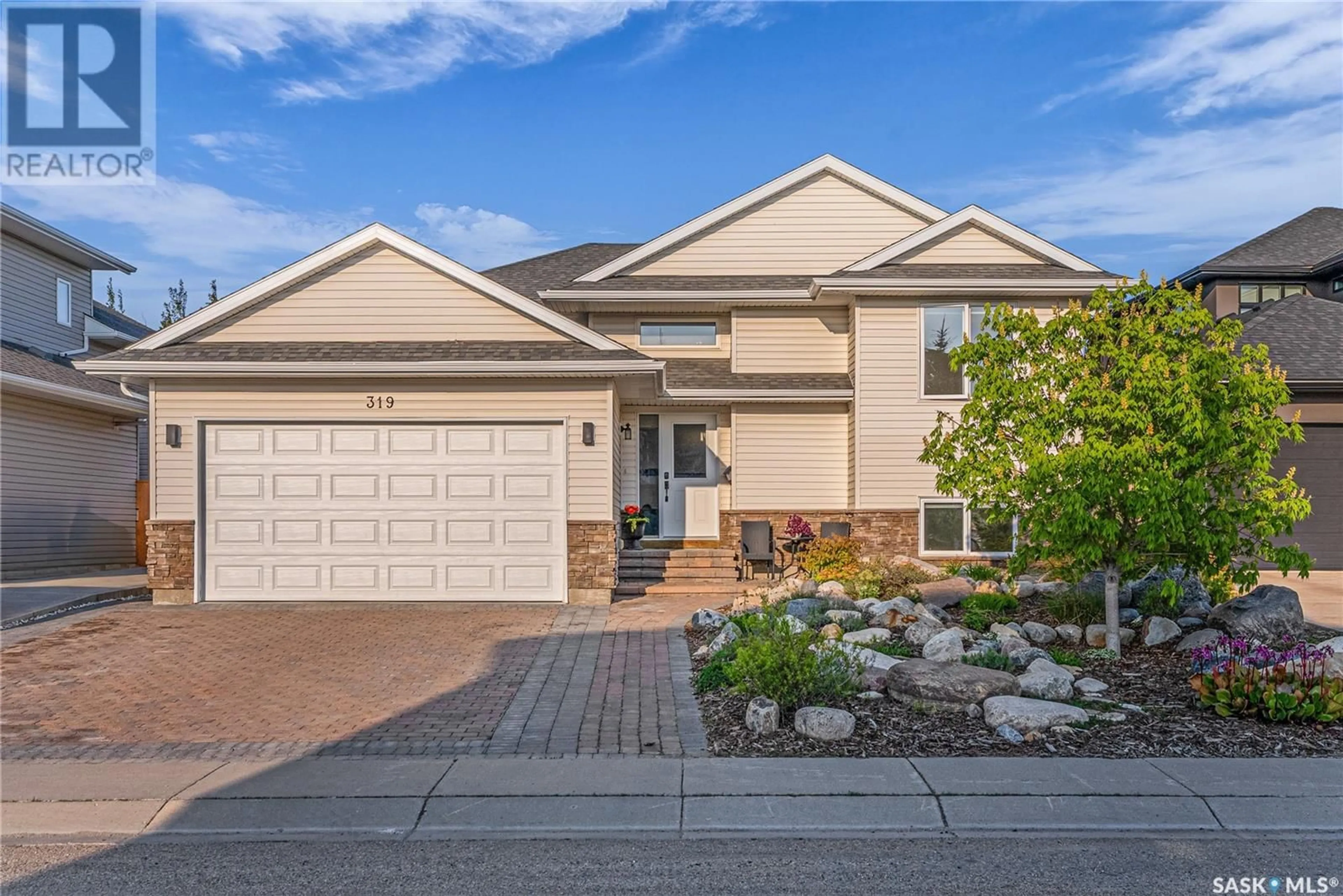 Home with vinyl exterior material, street for 319 ATTON CRESCENT, Saskatoon Saskatchewan S7W0K8