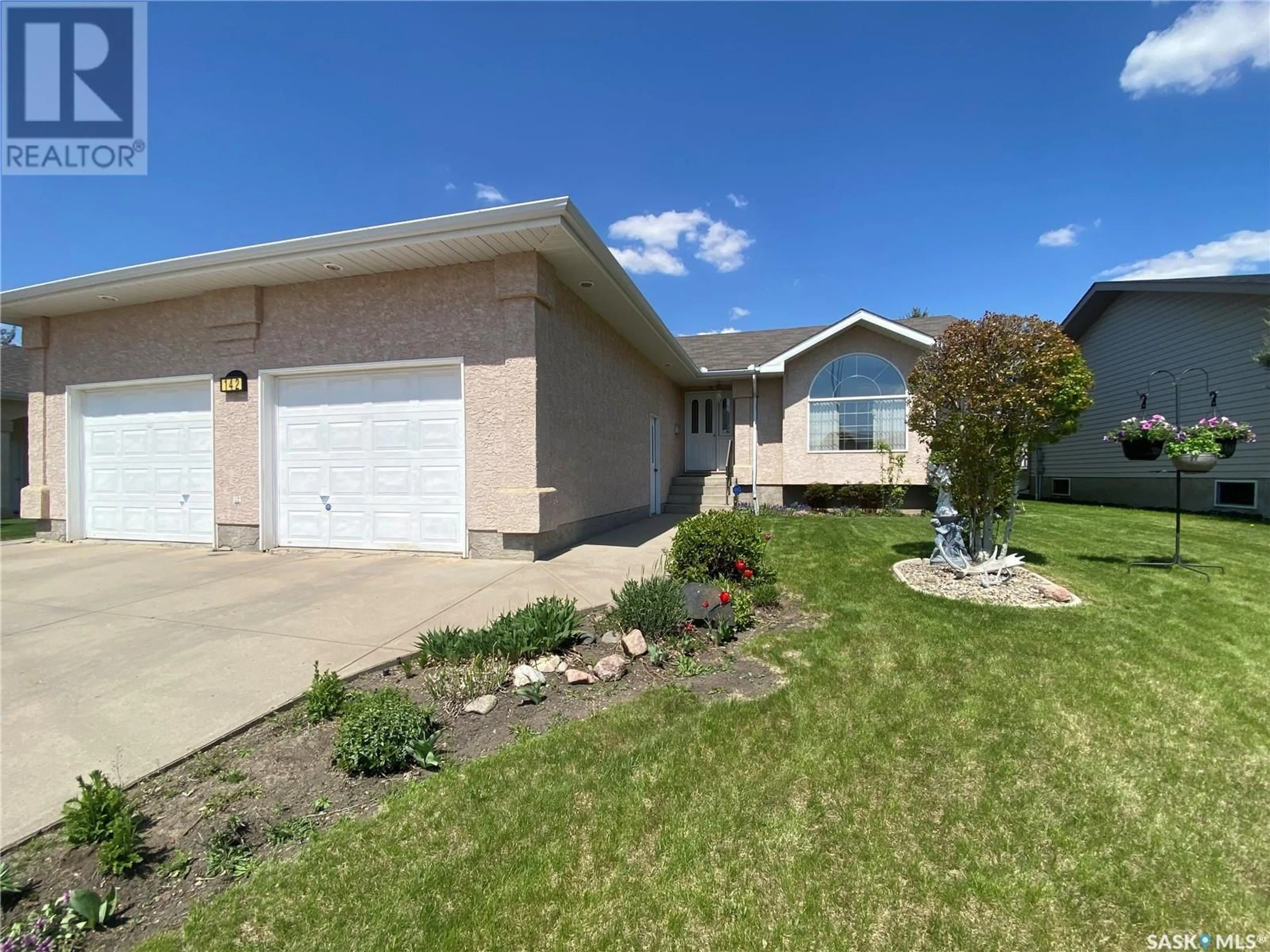 Home with vinyl exterior material, street for 142 CALDWELL DRIVE, Yorkton Saskatchewan S3N4A5