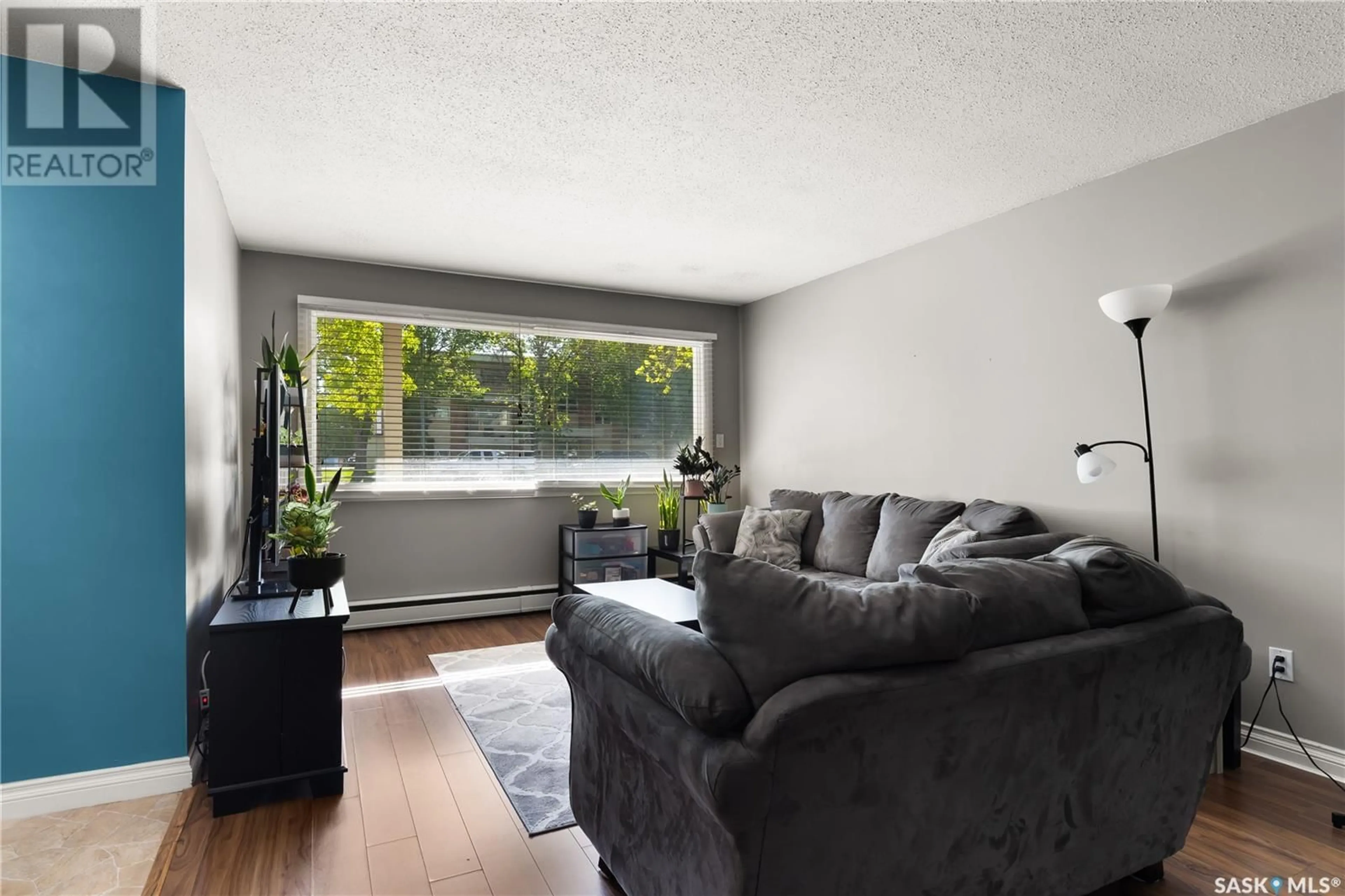Living room with furniture, wood/laminate floor for 4 - 1811 8TH AVENUE, Regina Saskatchewan S4R0G5