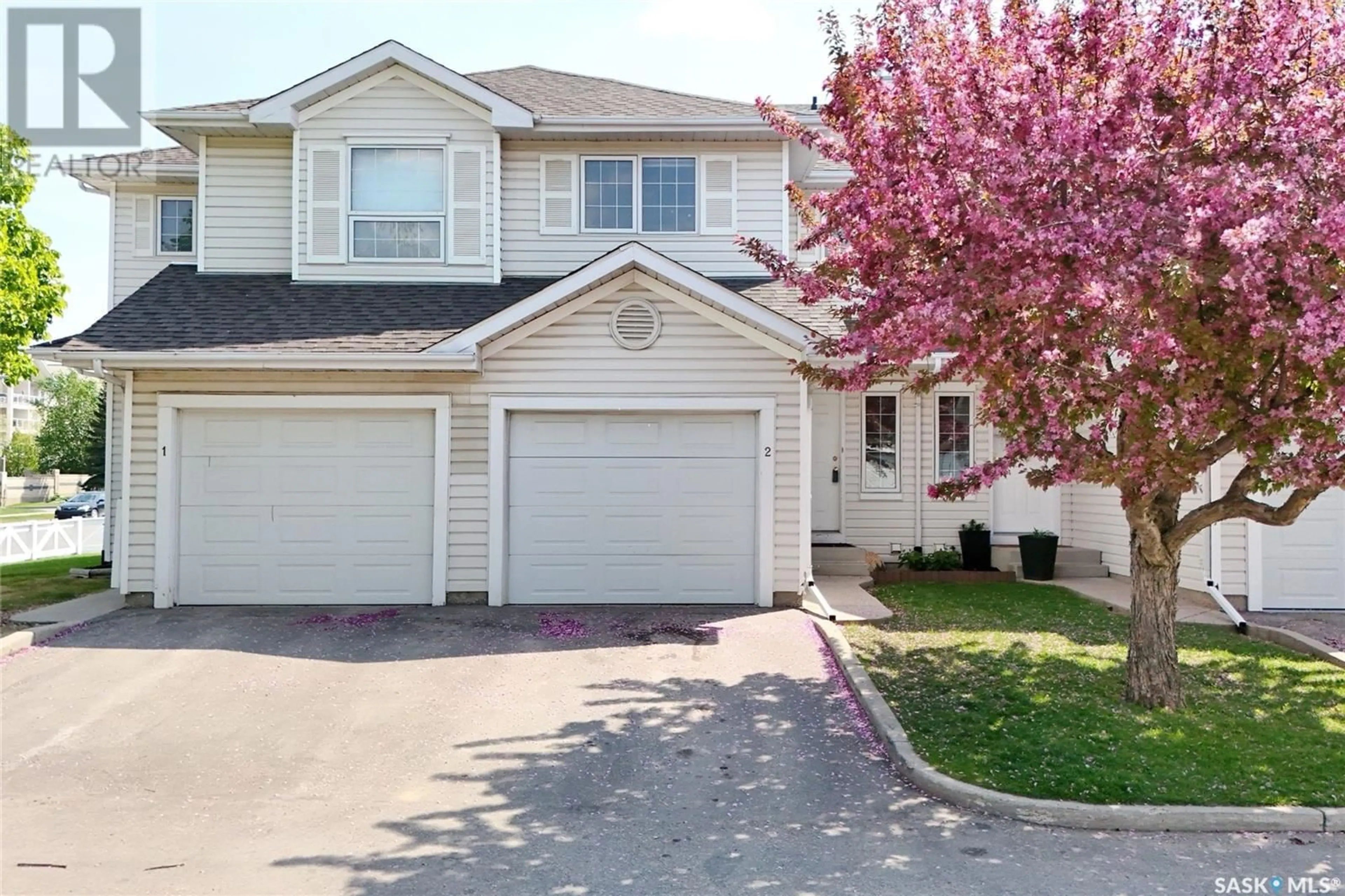 Home with vinyl exterior material, street for 2 110 KEEVIL CRESCENT, Saskatoon Saskatchewan S7N4L9
