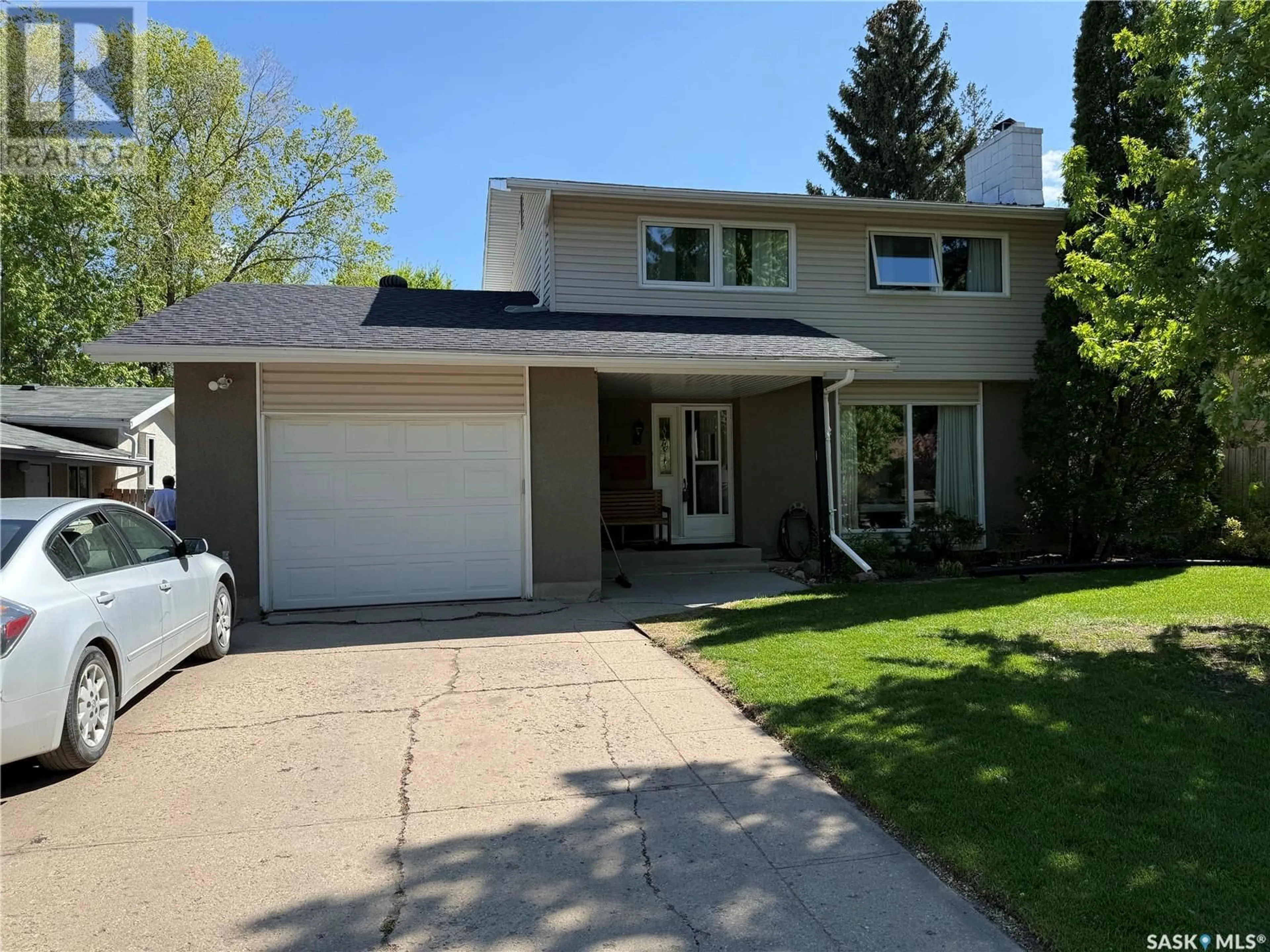 Home with vinyl exterior material, street for 91 SUNSET DRIVE, Regina Saskatchewan S4S5V7