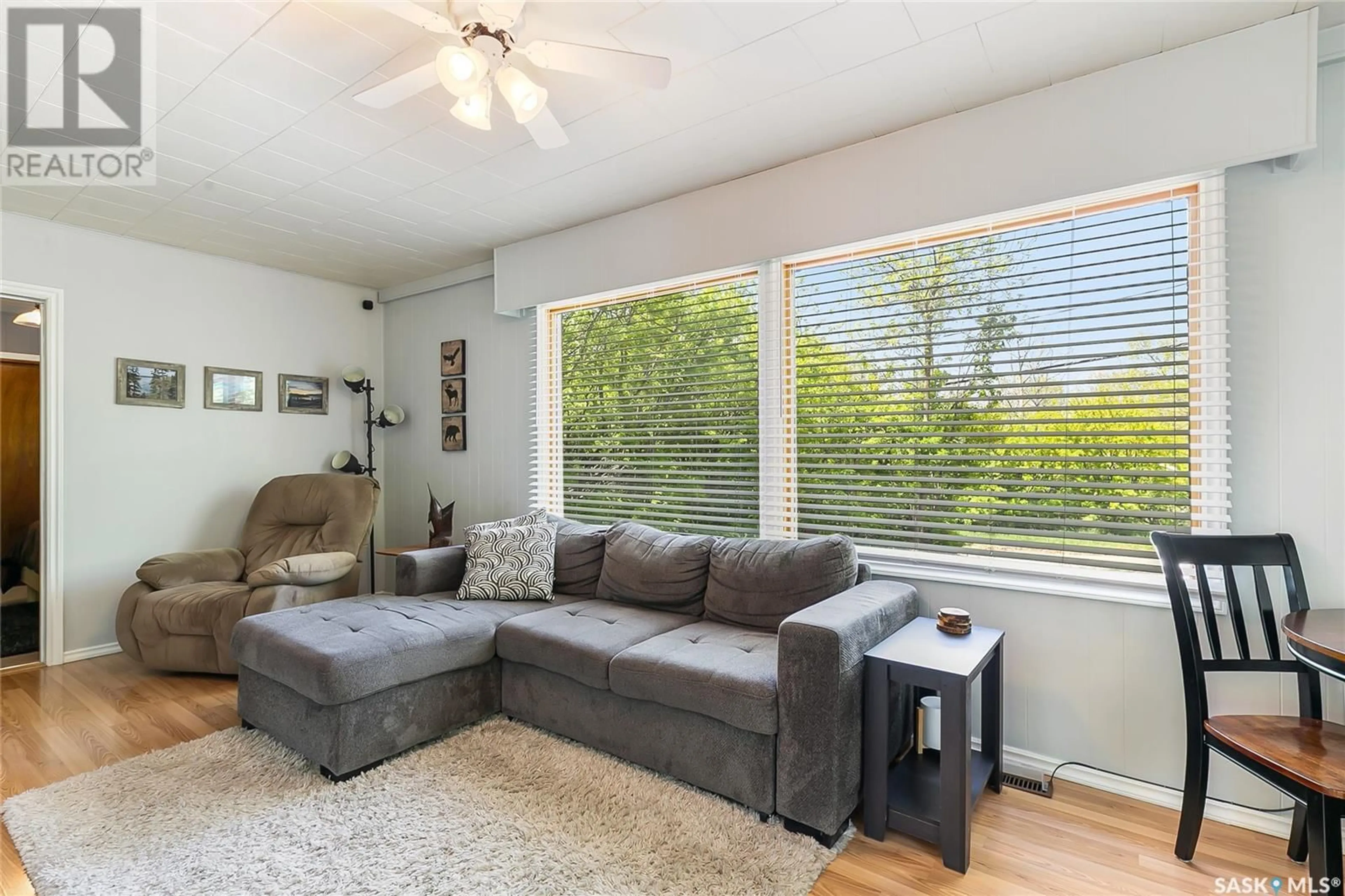 Living room with furniture, wood/laminate floor for 463 GREEN AVENUE, Regina Beach Saskatchewan S0G4C0