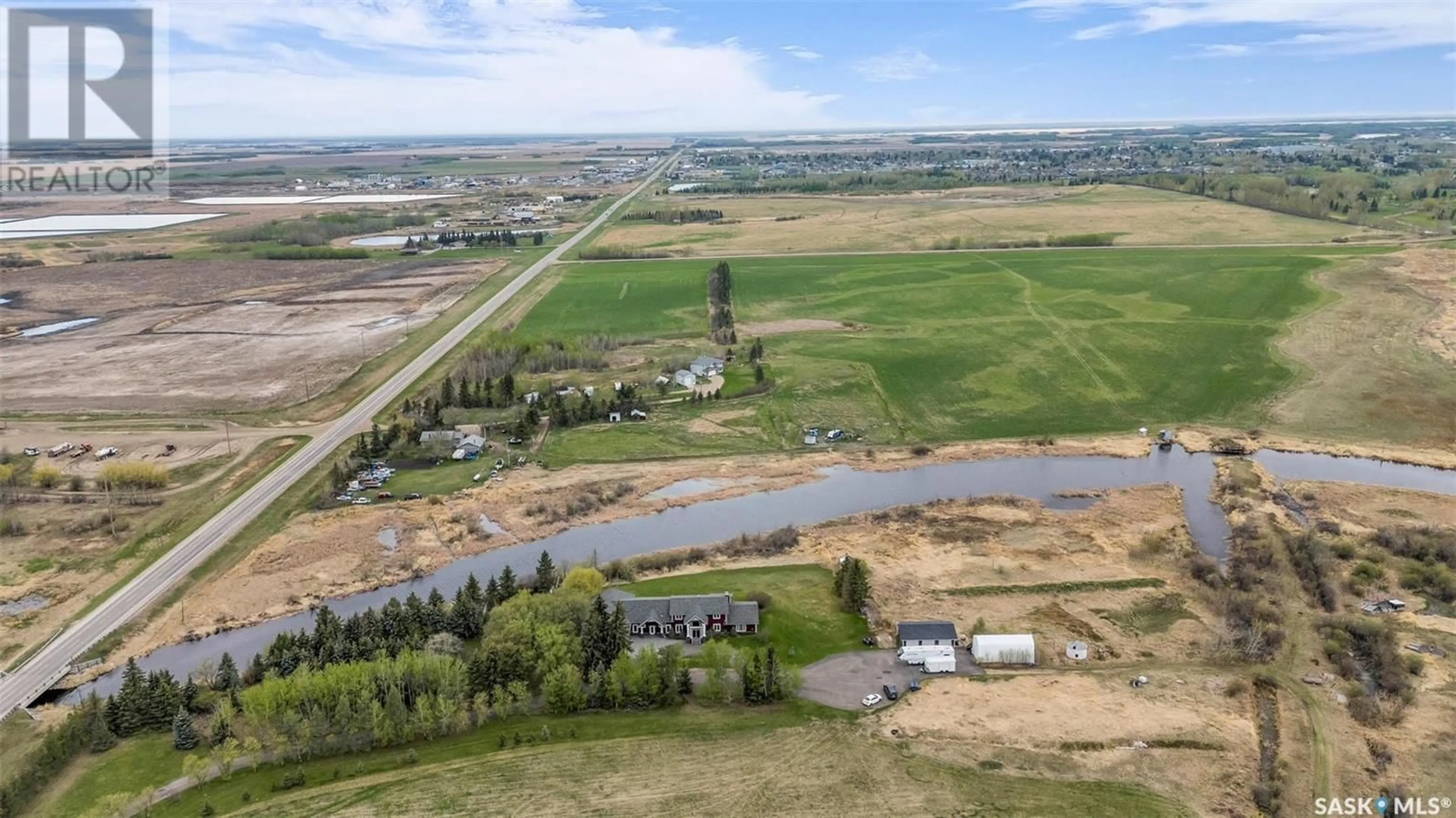 A pic from outside/outdoor area/front of a property/back of a property/a pic from drone, water/lake/river/ocean view for BACKWATER CREEK ACREAGE, Meadow Lake Rm No.588 Saskatchewan S9X1Z5