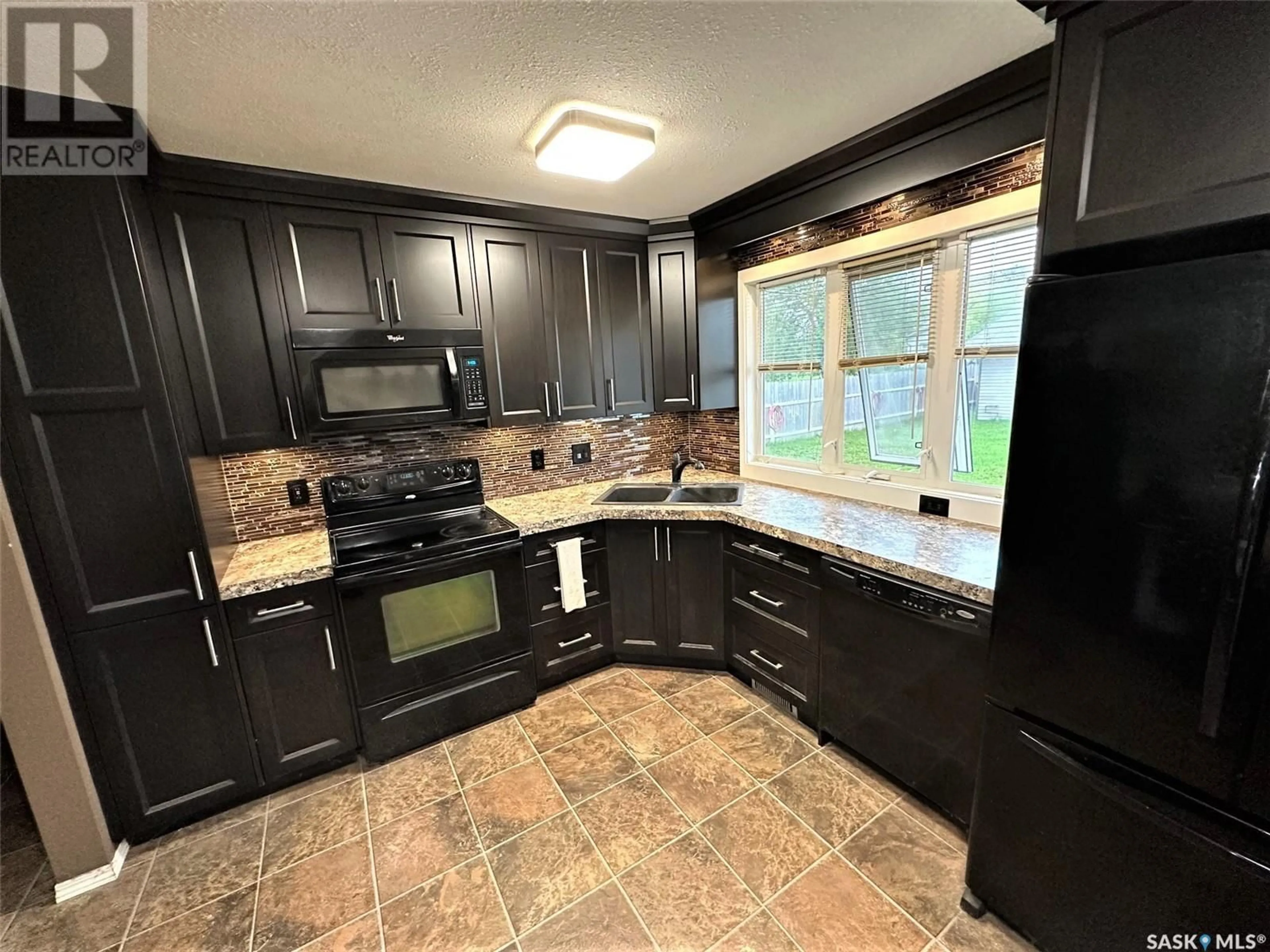 Open concept kitchen, ceramic/tile floor for 701 DONALD STREET, Hudson Bay Saskatchewan S0E0Y0