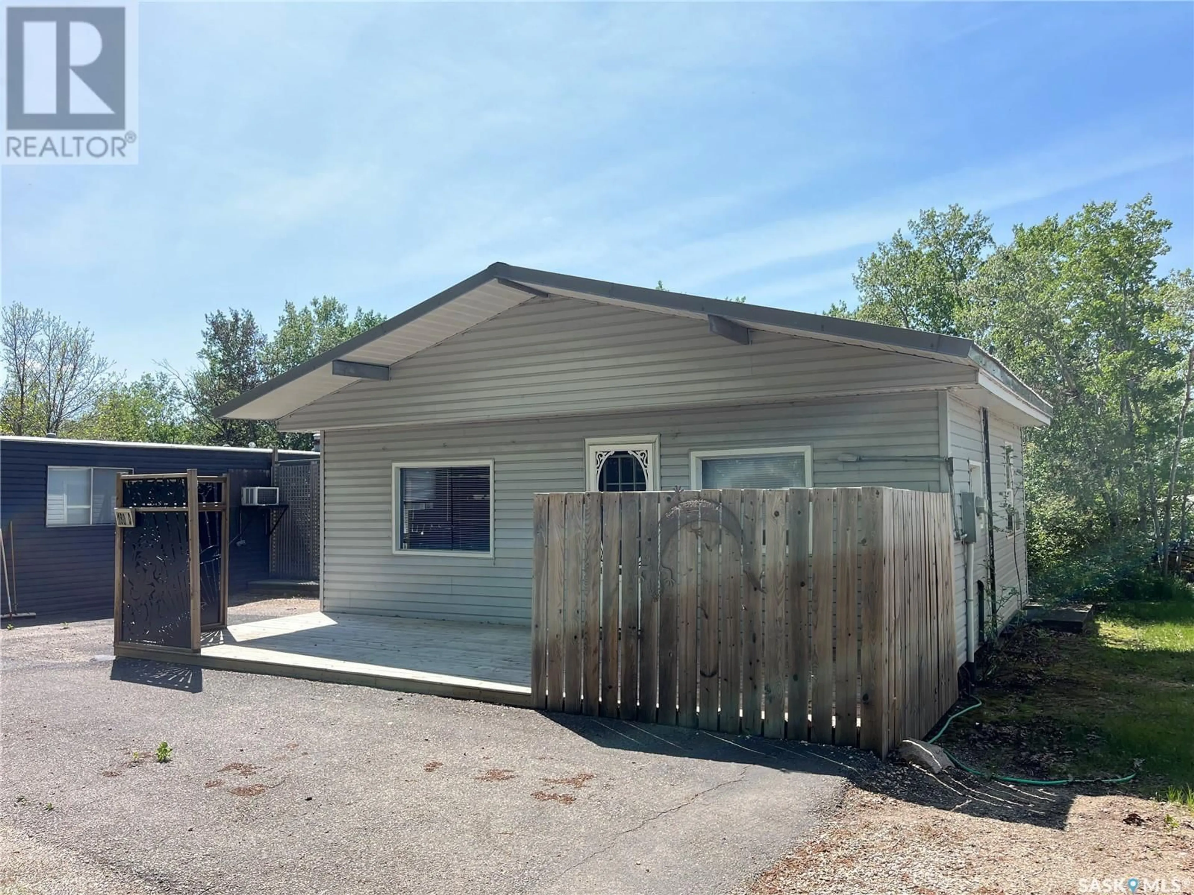Home with vinyl exterior material, street for 513 SANDY ROAD, Leslie Beach Saskatchewan S0A1A0