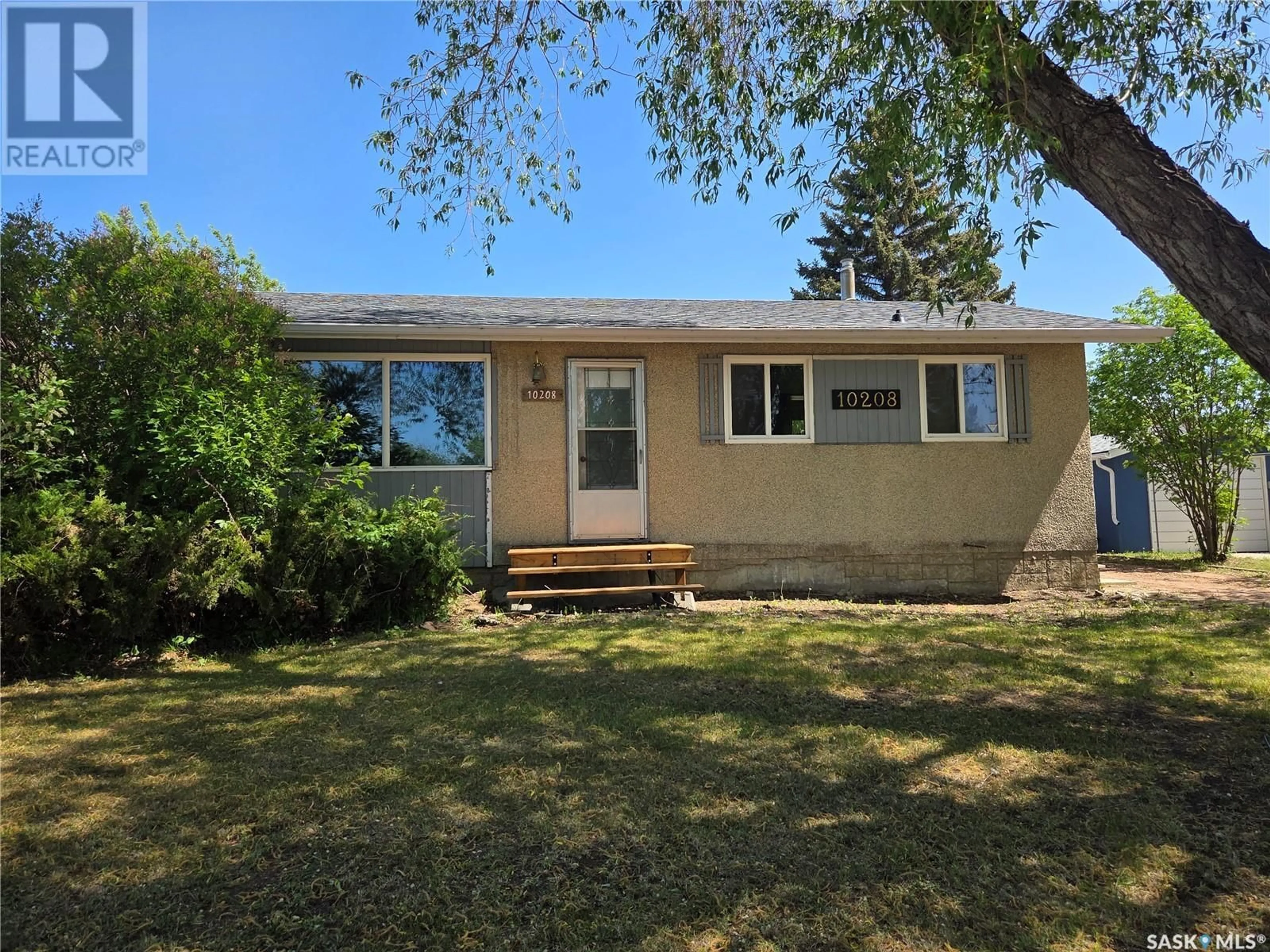 Home with vinyl exterior material, street for 10208 BORDEN CRESCENT, North Battleford Saskatchewan S9A3A1