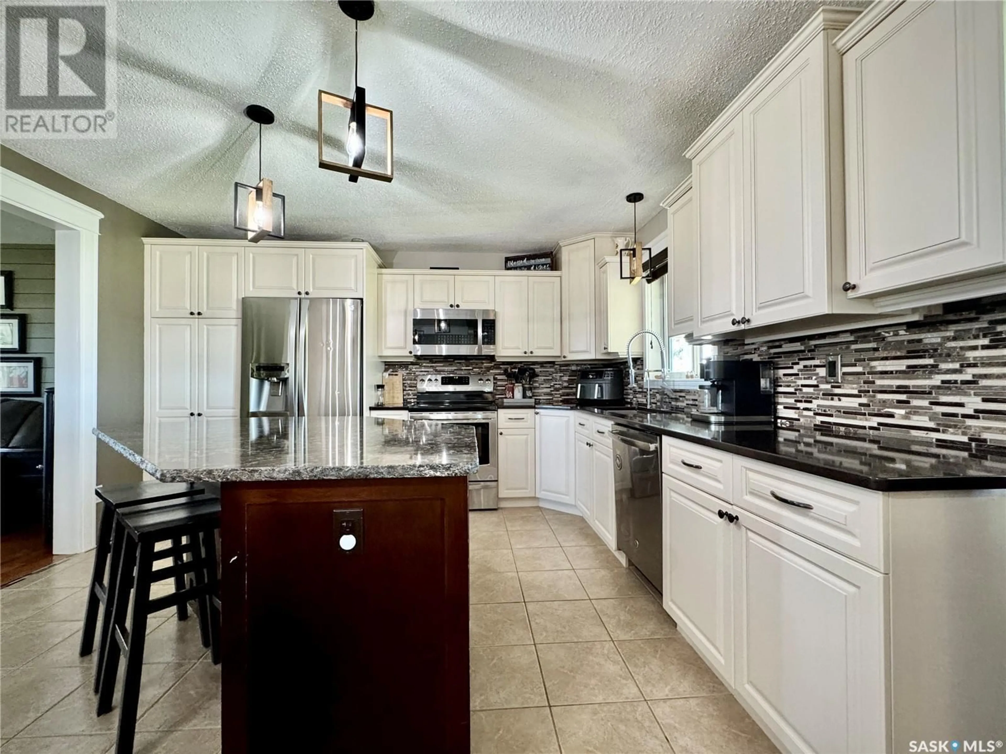 Open concept kitchen, ceramic/tile floor for MERCEREAU ACREAGE, Churchbridge Rm No. 211 Saskatchewan S0A0M0