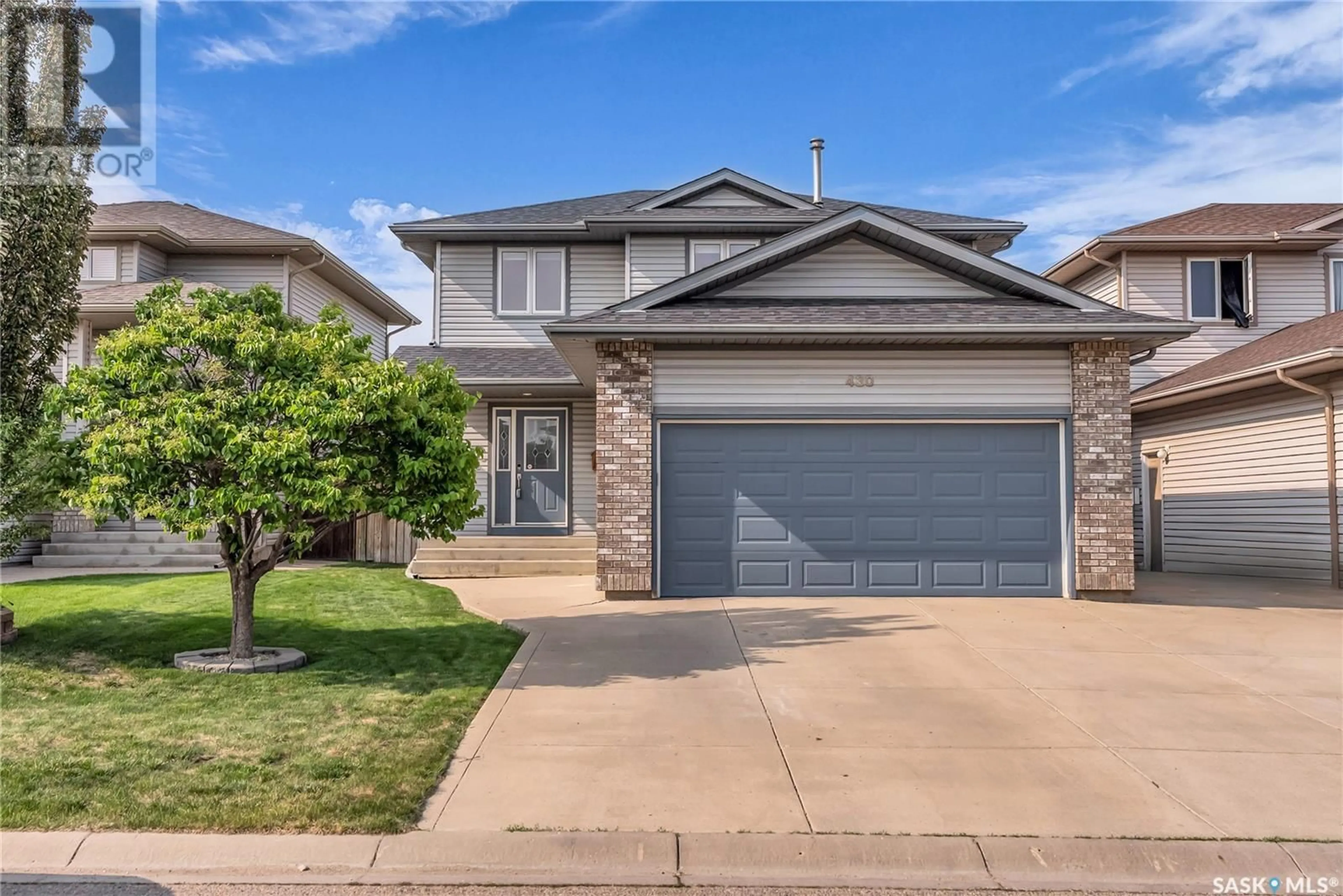 Home with vinyl exterior material, street for 430 BUCKWOLD COVE, Saskatoon Saskatchewan S7N4V9
