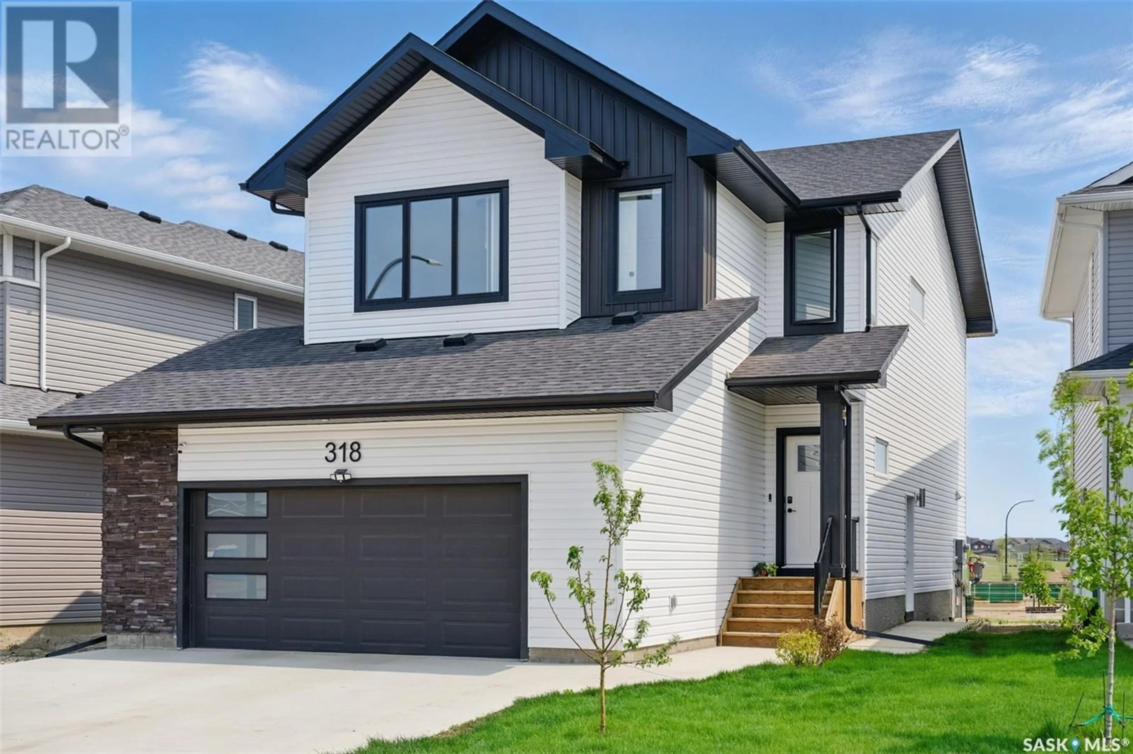 Home with vinyl exterior material, street for 318 PRASAD UNION, Saskatoon Saskatchewan S7V1L7