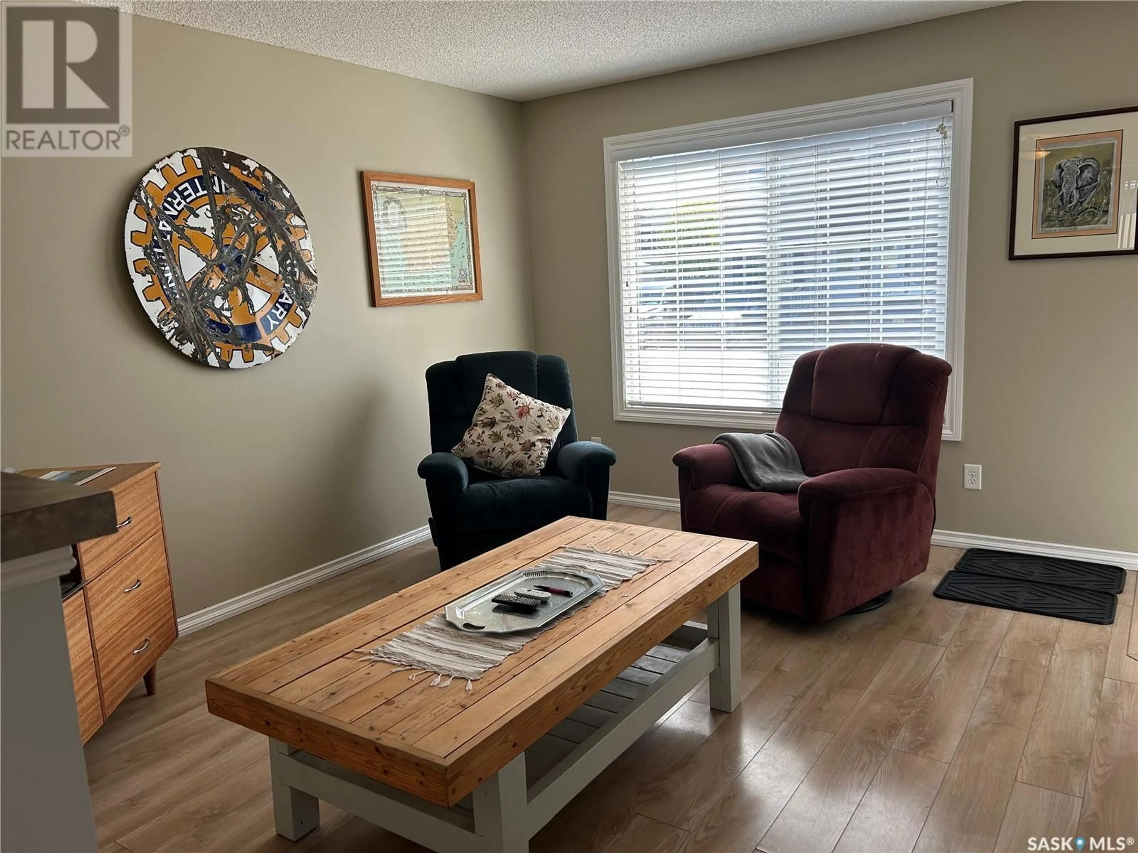 Living room with furniture, wood/laminate floor for 3 - 1621 1ST STREET, Estevan Saskatchewan S4A2X4