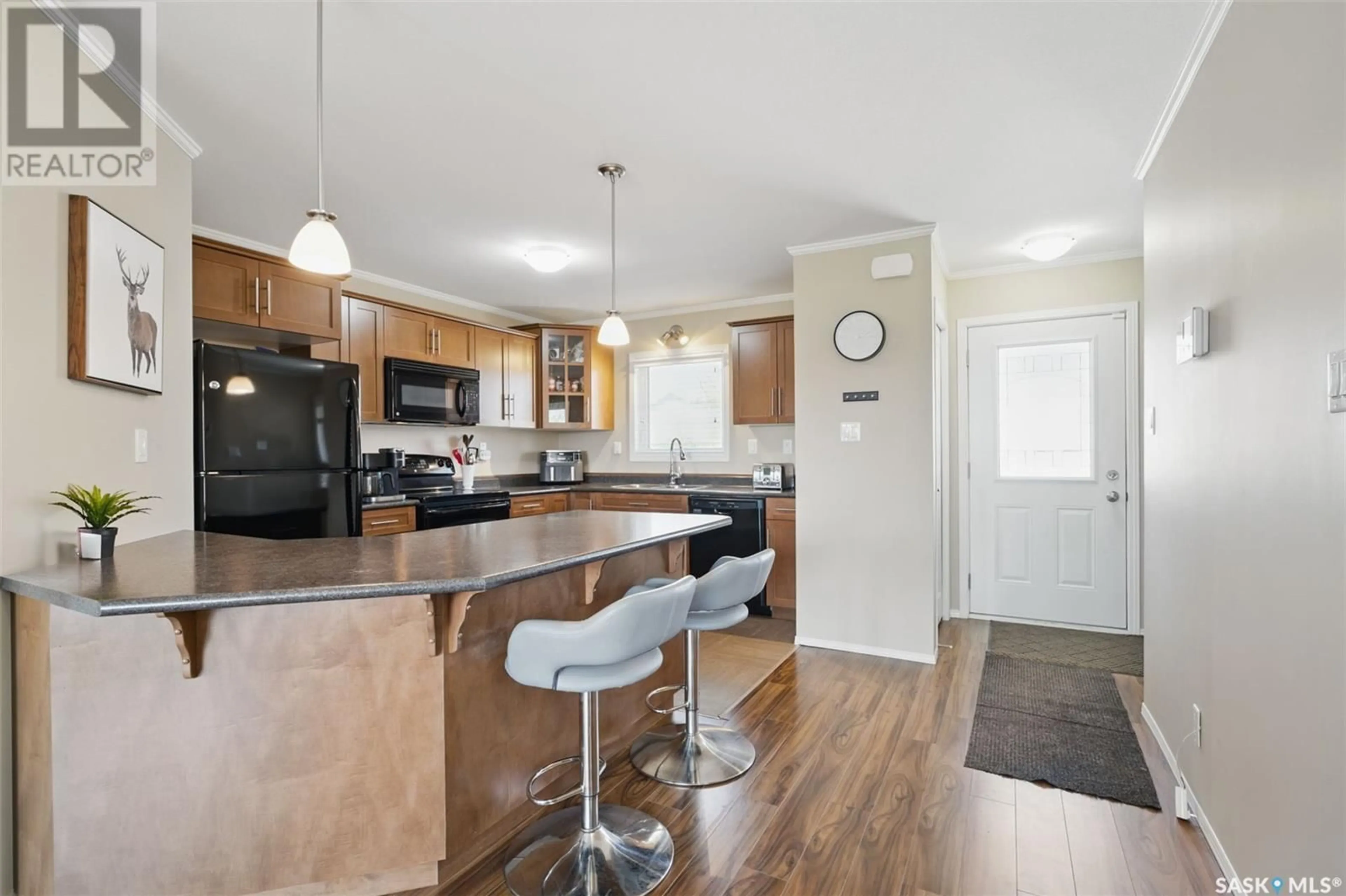Open concept kitchen, wood/laminate floor for 115 - 302 DALGLEISH LINK, Saskatoon Saskatchewan S7W0N5