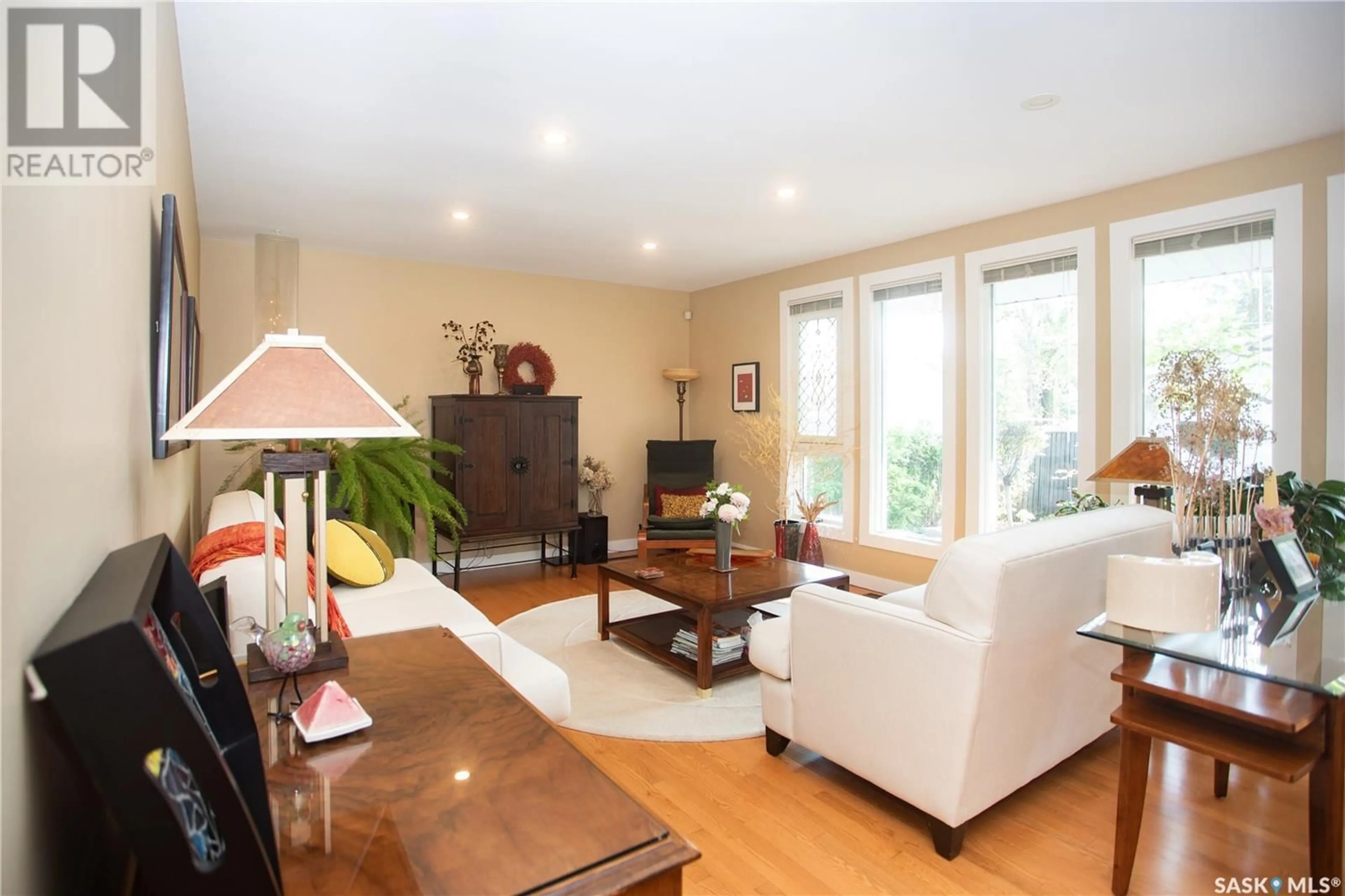 Living room with furniture, wood/laminate floor for 312 BATE CRESCENT, Saskatoon Saskatchewan S7H3A5