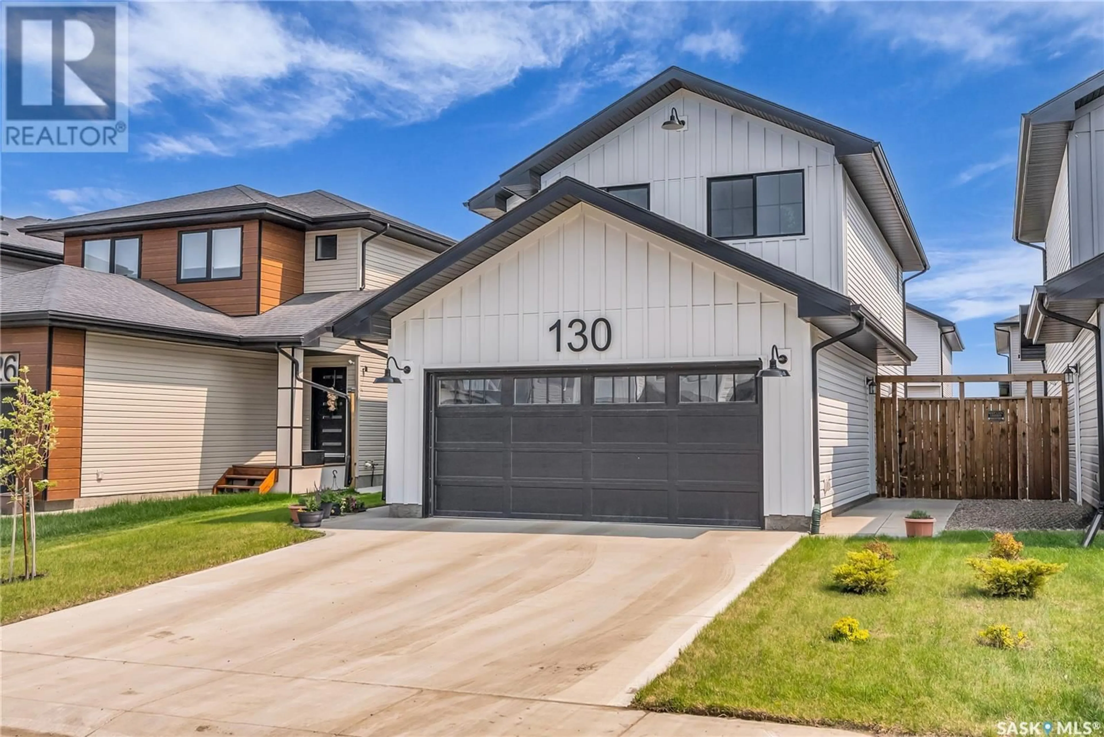Home with vinyl exterior material, street for 130 DORAN WAY, Saskatoon Saskatchewan S7V0Z7