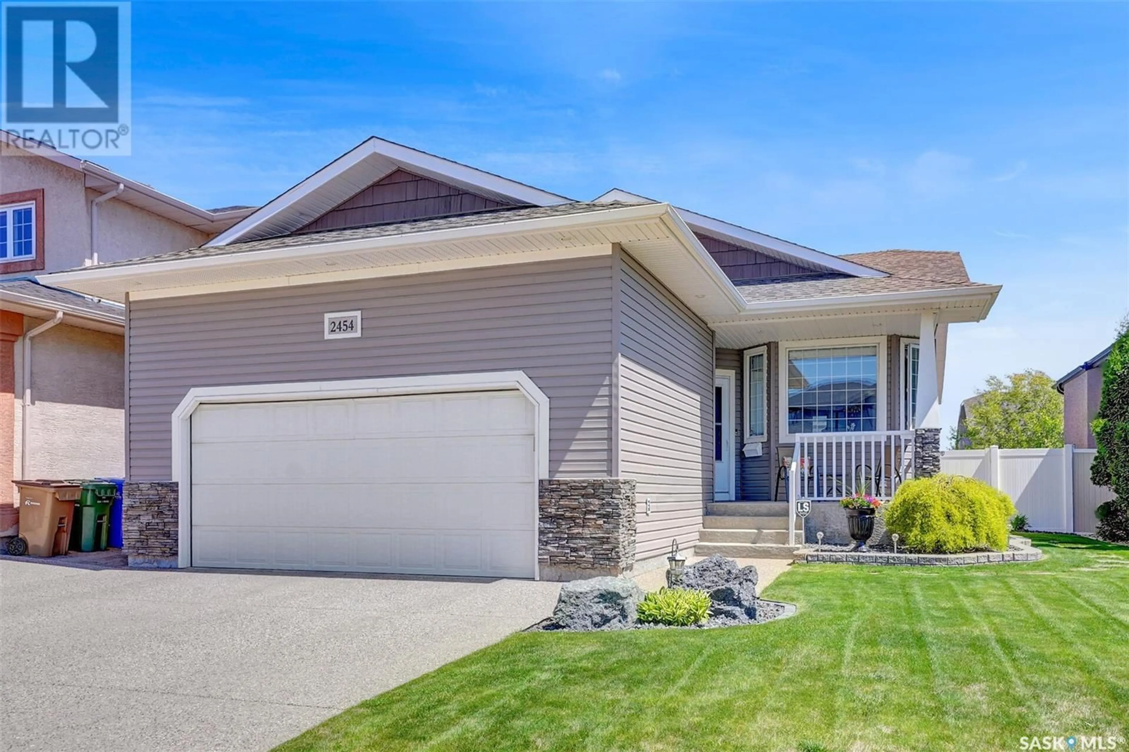 Home with vinyl exterior material, street for 2454 JAMESON CRESCENT, Regina Saskatchewan S4V1J7