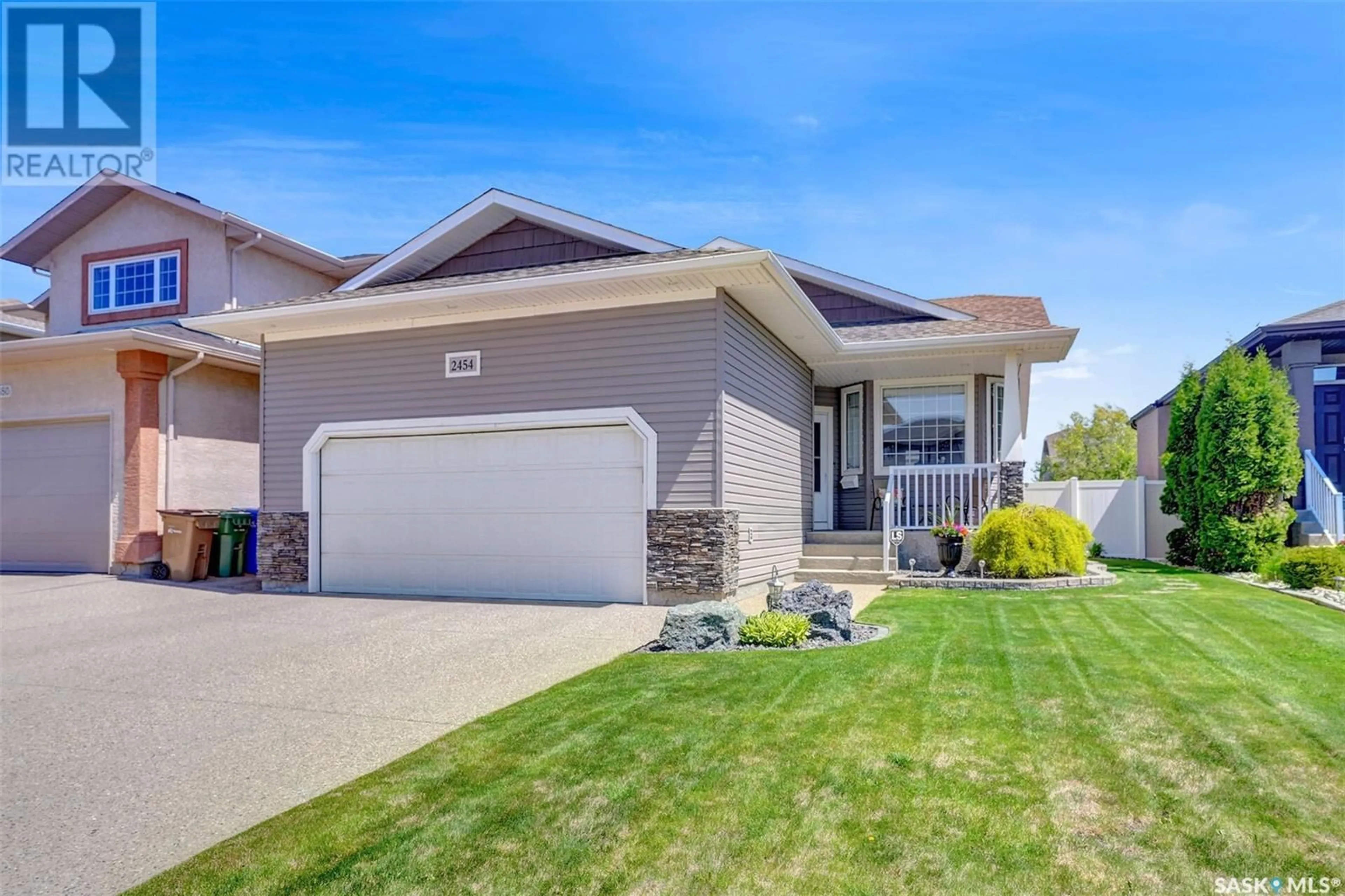 Home with vinyl exterior material, street for 2454 JAMESON CRESCENT, Regina Saskatchewan S4V1J7