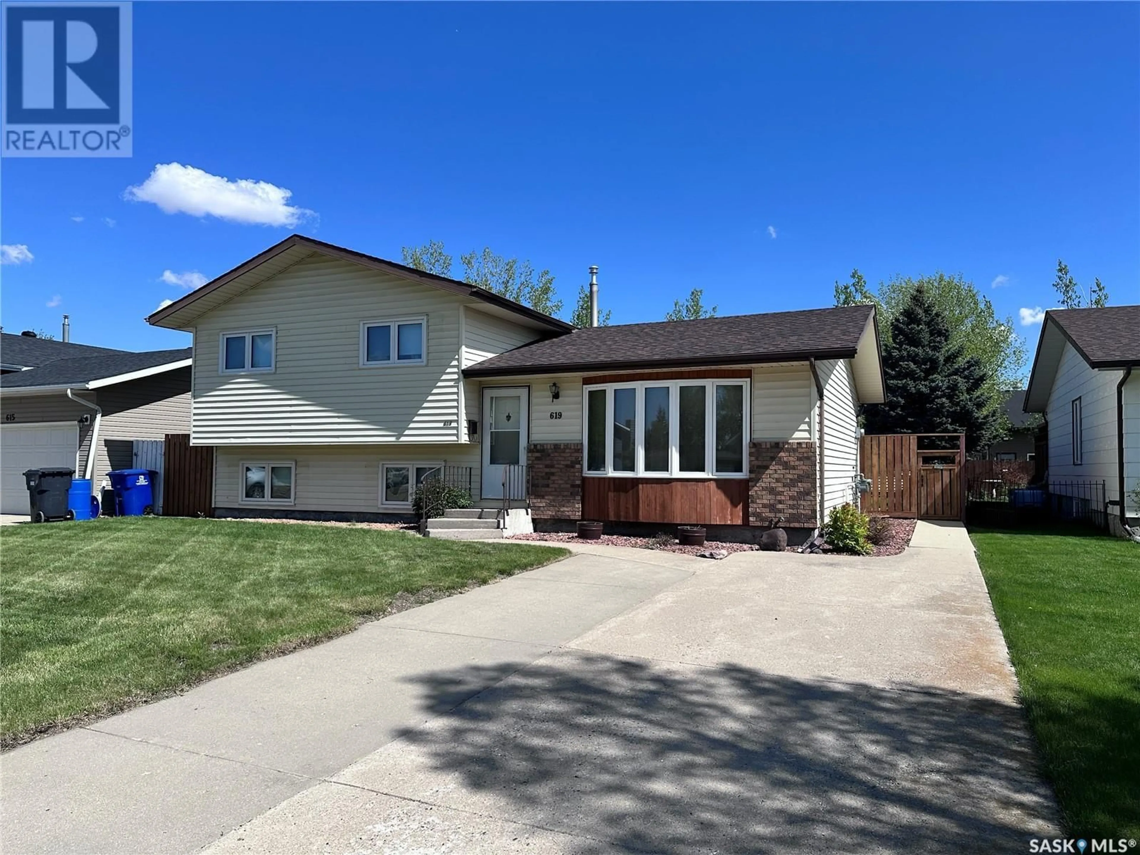 Home with vinyl exterior material, street for 619 DIEPPE DRIVE, Weyburn Saskatchewan S4H3K9