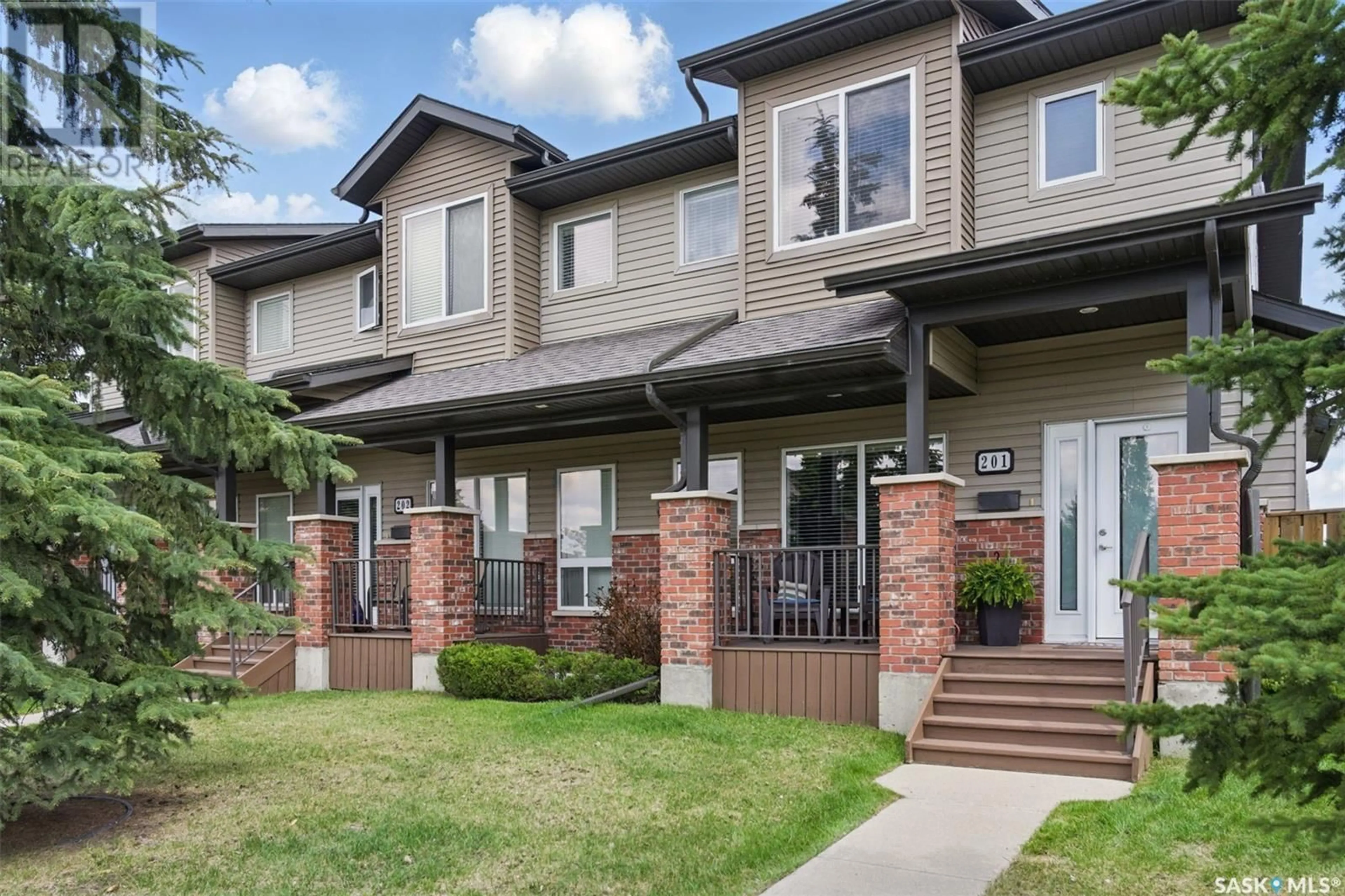 Home with brick exterior material, street for 201 STENSRUD ROAD, Saskatoon Saskatchewan S7W0E3