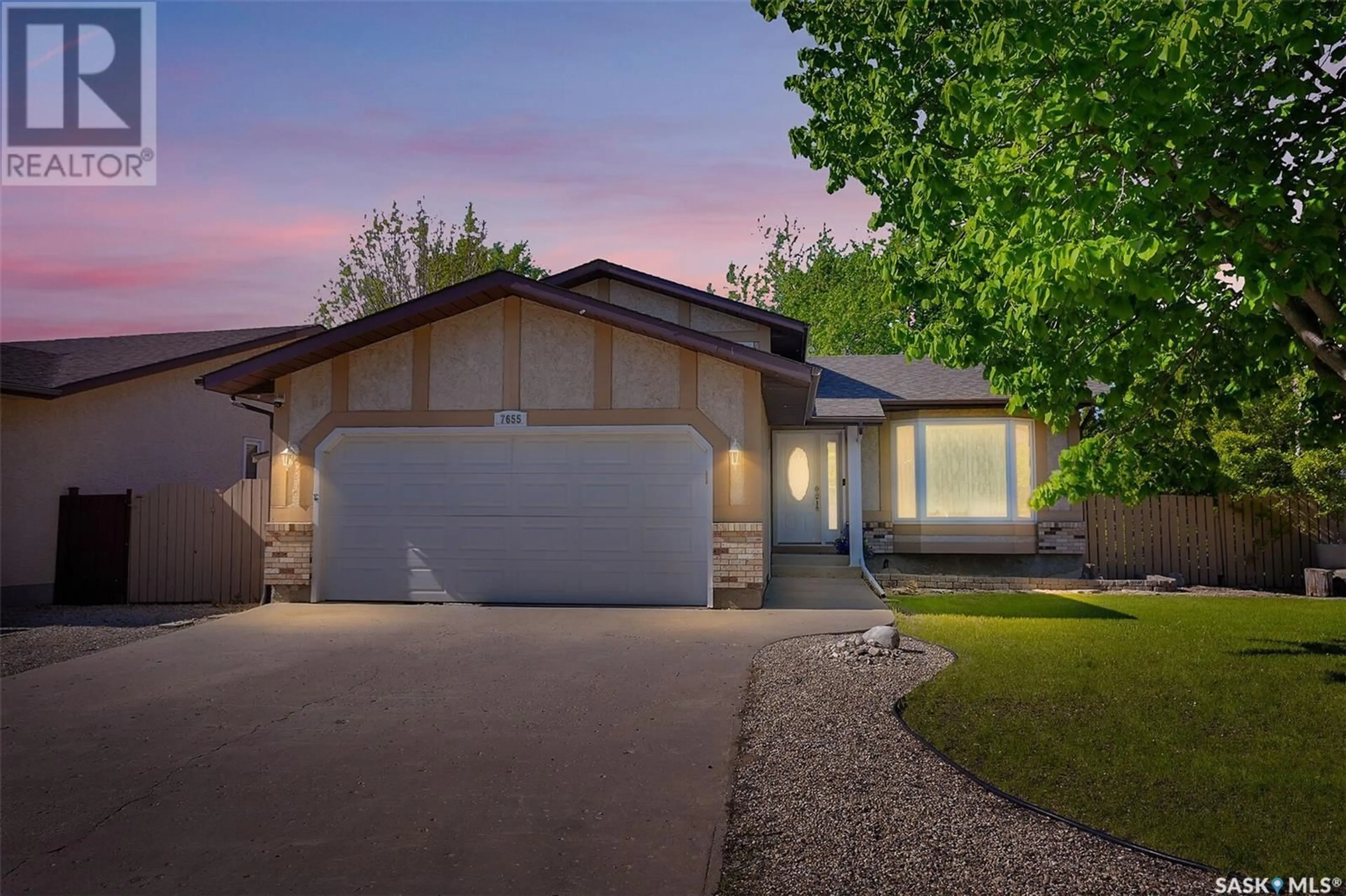 Home with vinyl exterior material, street for 7655 DISCOVERY ROAD, Regina Saskatchewan S4Y1E5