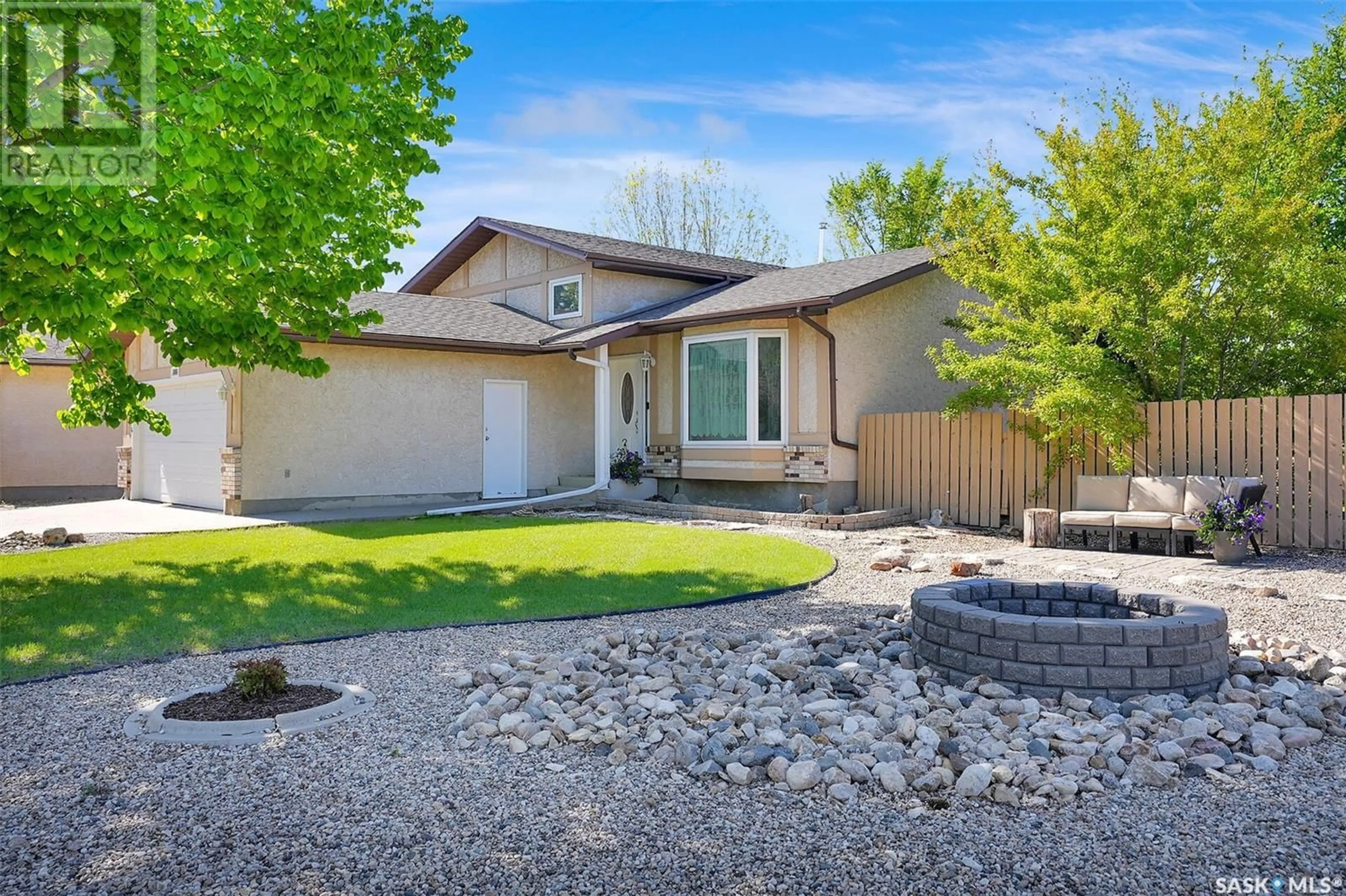 Home with vinyl exterior material, street for 7655 DISCOVERY ROAD, Regina Saskatchewan S4Y1E5