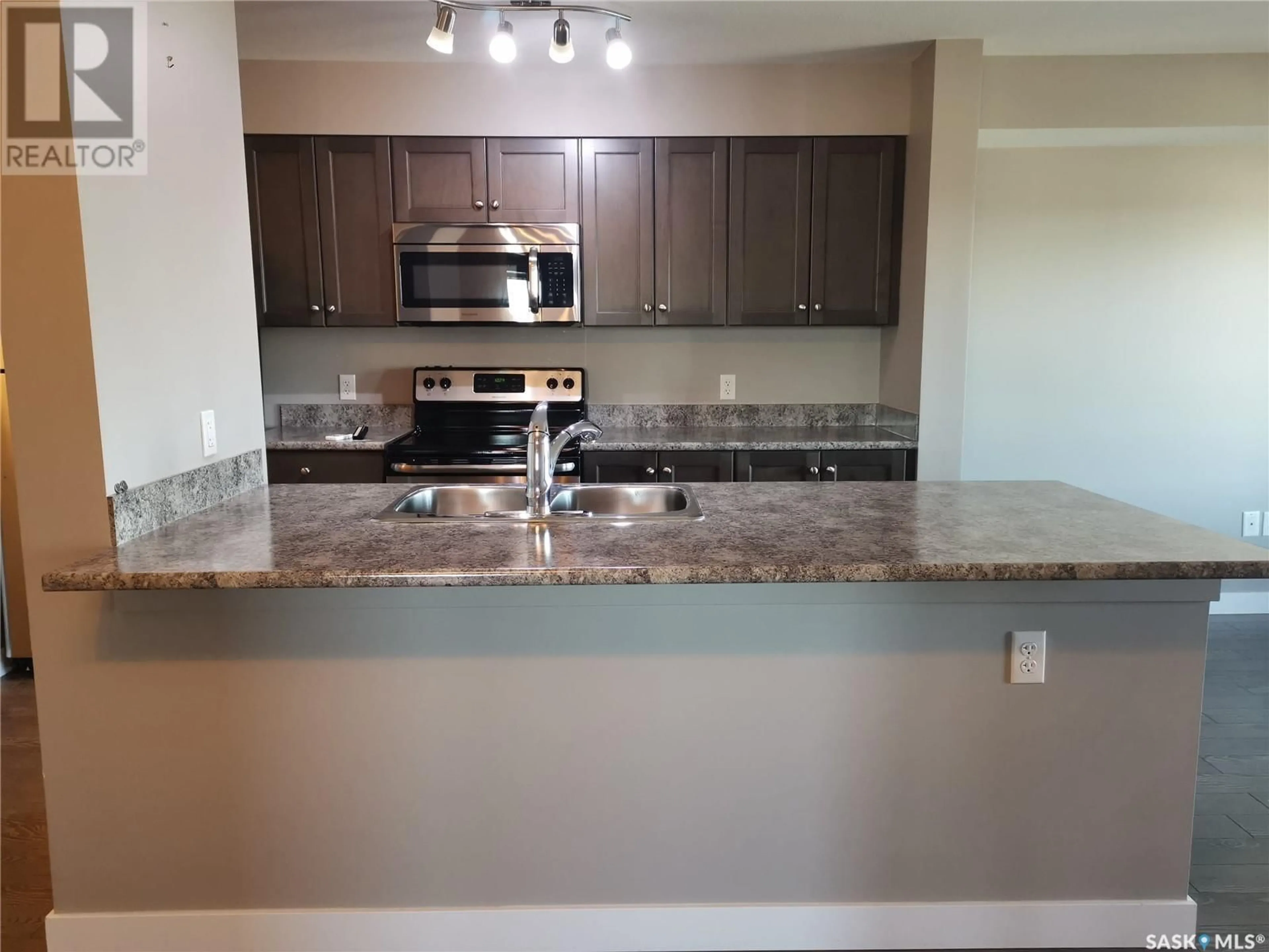 Open concept kitchen, ceramic/tile floor for 209 - 2141 LARTER ROAD, Estevan Saskatchewan S4A2Y5