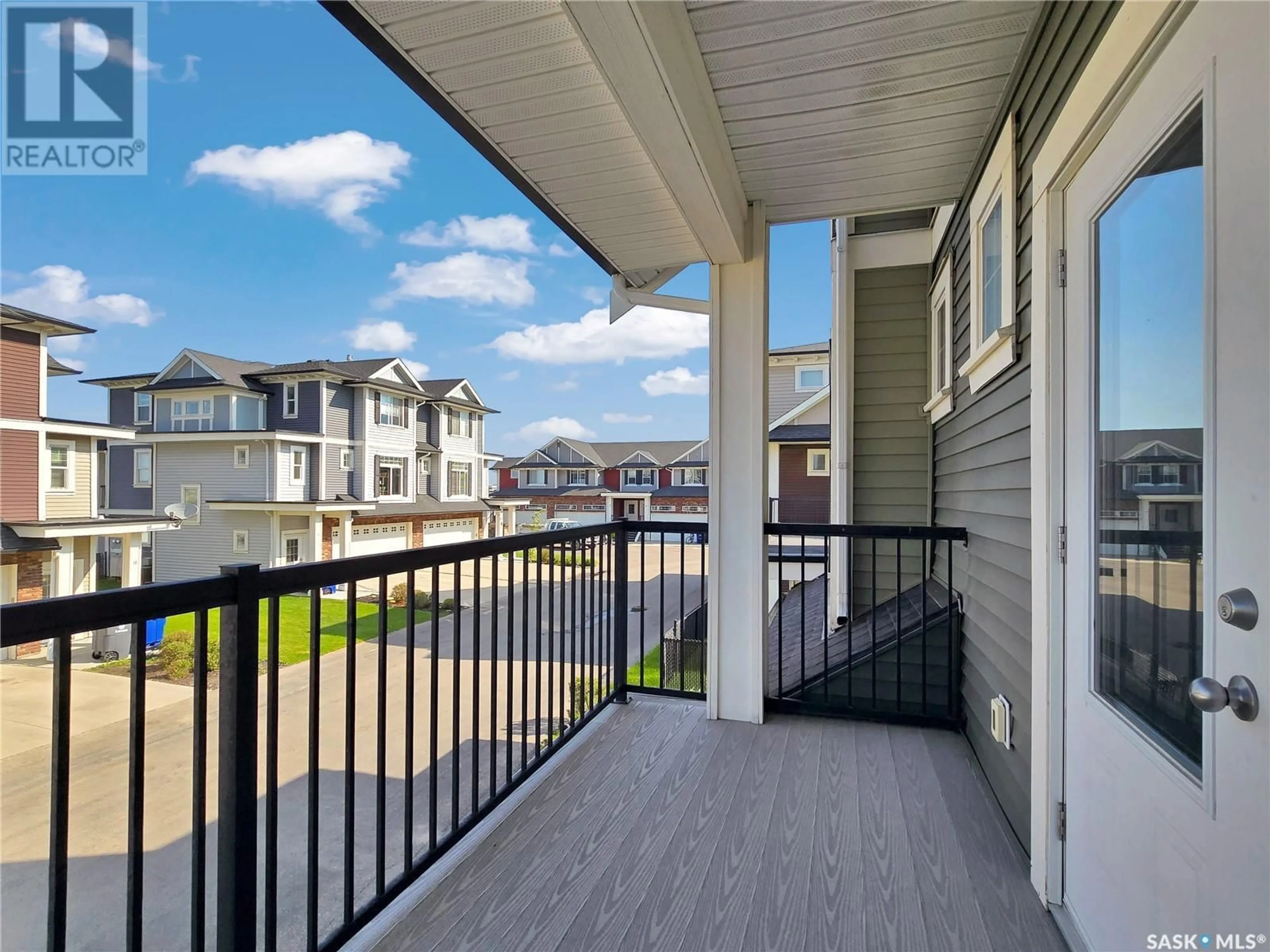 Patio, city buildings view from balcony for 425 - 36 LANGER PLACE, Warman Saskatchewan S0K4S1