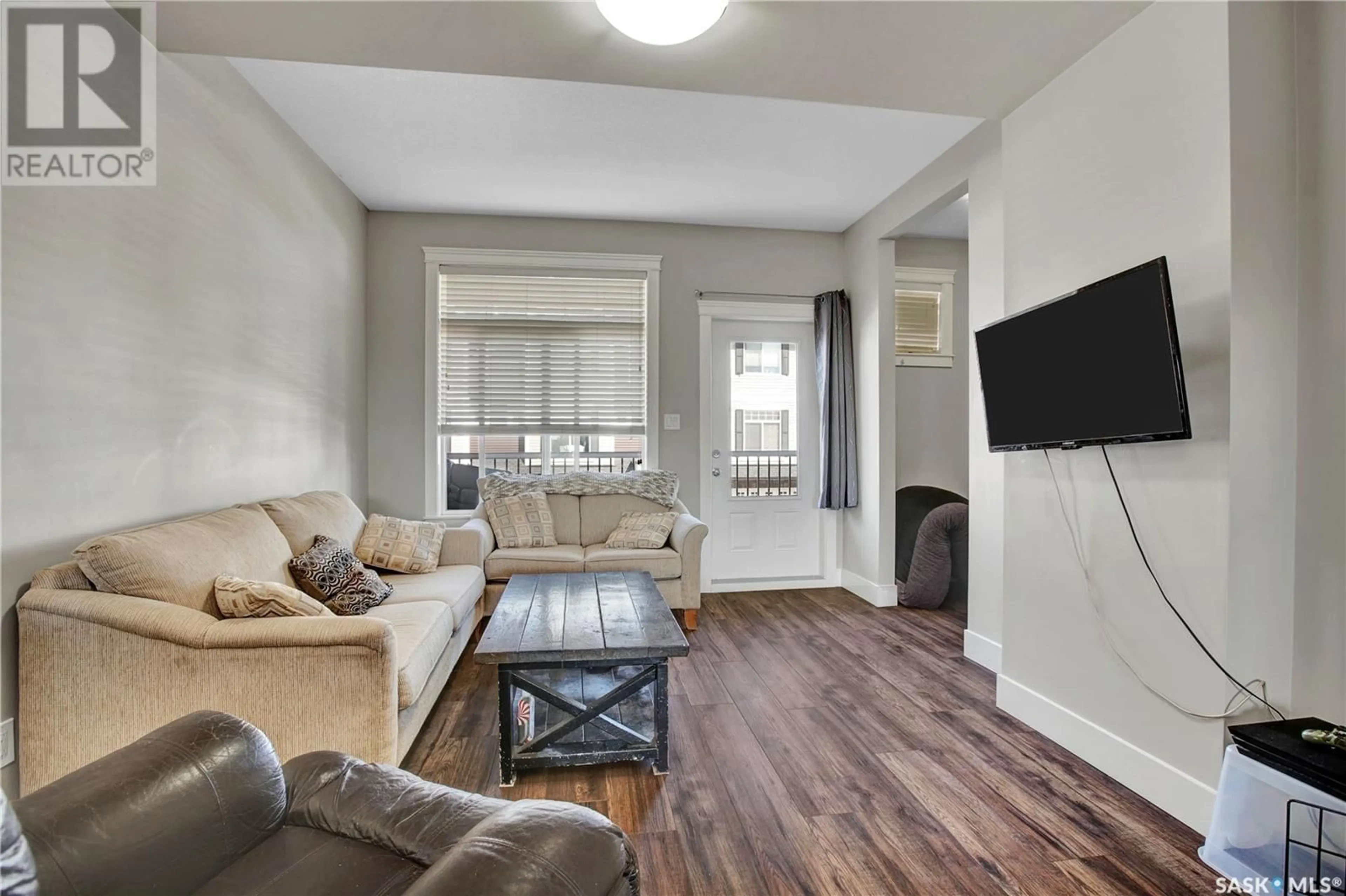 Living room with furniture, wood/laminate floor for 425 - 36 LANGER PLACE, Warman Saskatchewan S0K4S1