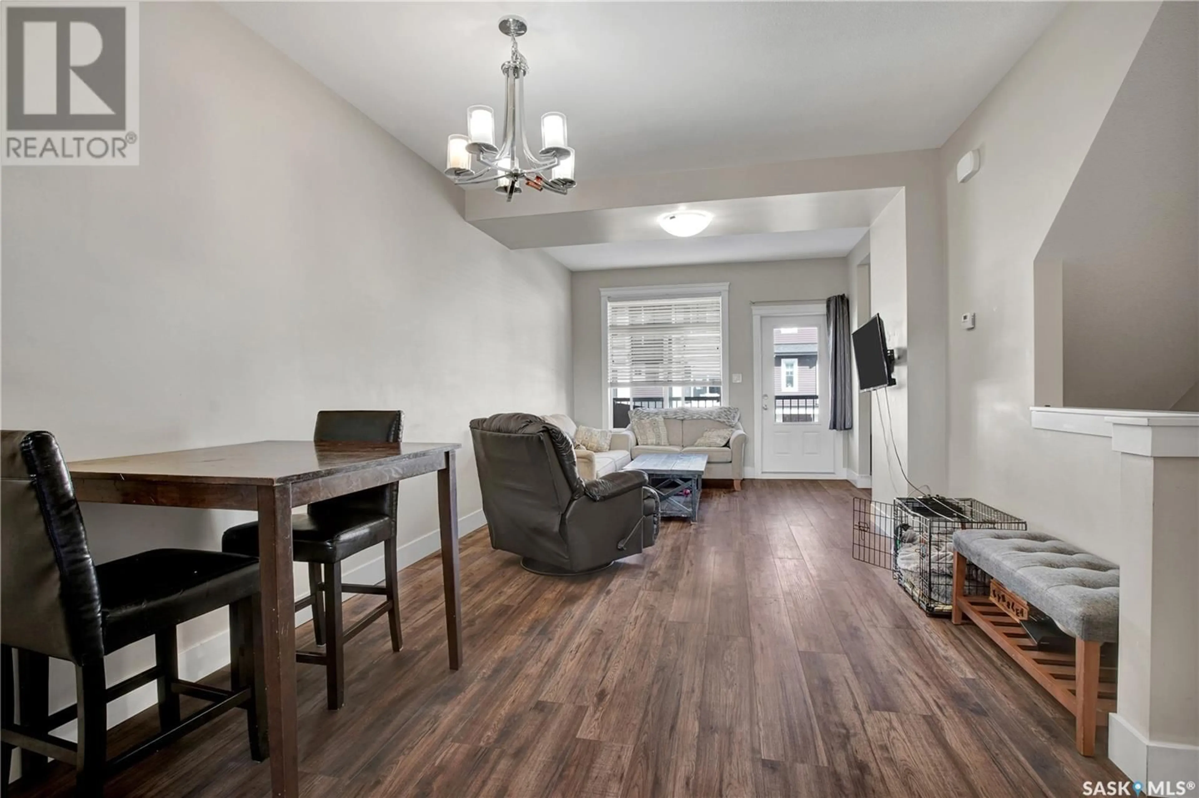 Living room with furniture, wood/laminate floor for 425 - 36 LANGER PLACE, Warman Saskatchewan S0K4S1