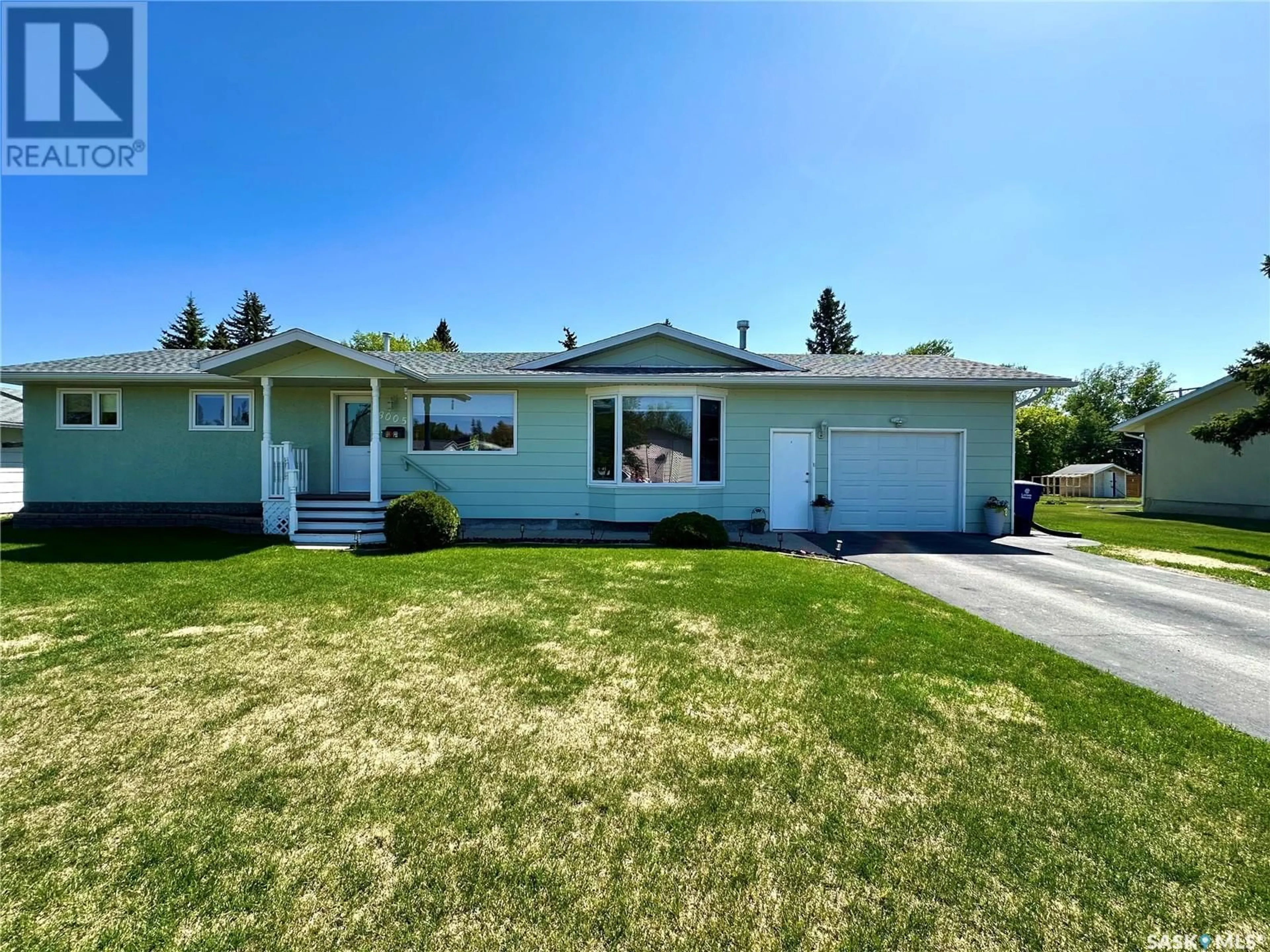 Home with vinyl exterior material, street for 8005 6TH STREET, Rosthern Saskatchewan S0K3R0