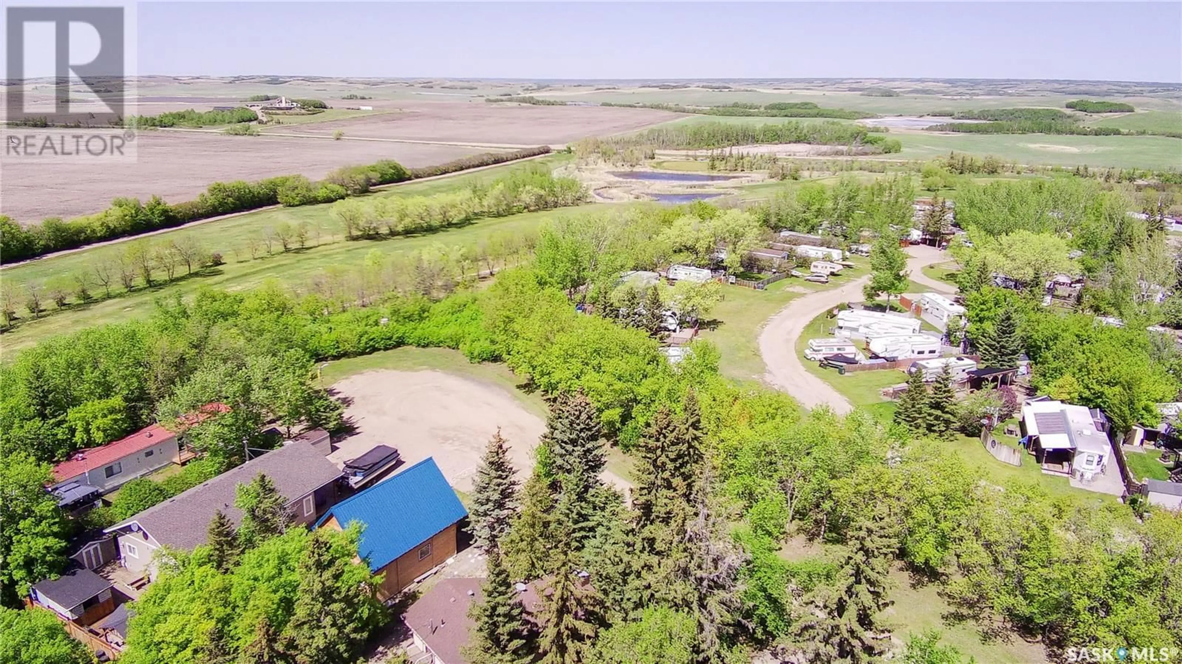 A pic from outside/outdoor area/front of a property/back of a property/a pic from drone, water/lake/river/ocean view for 511 EVINRUDE AVENUE, Aquadeo Saskatchewan S0M0L0