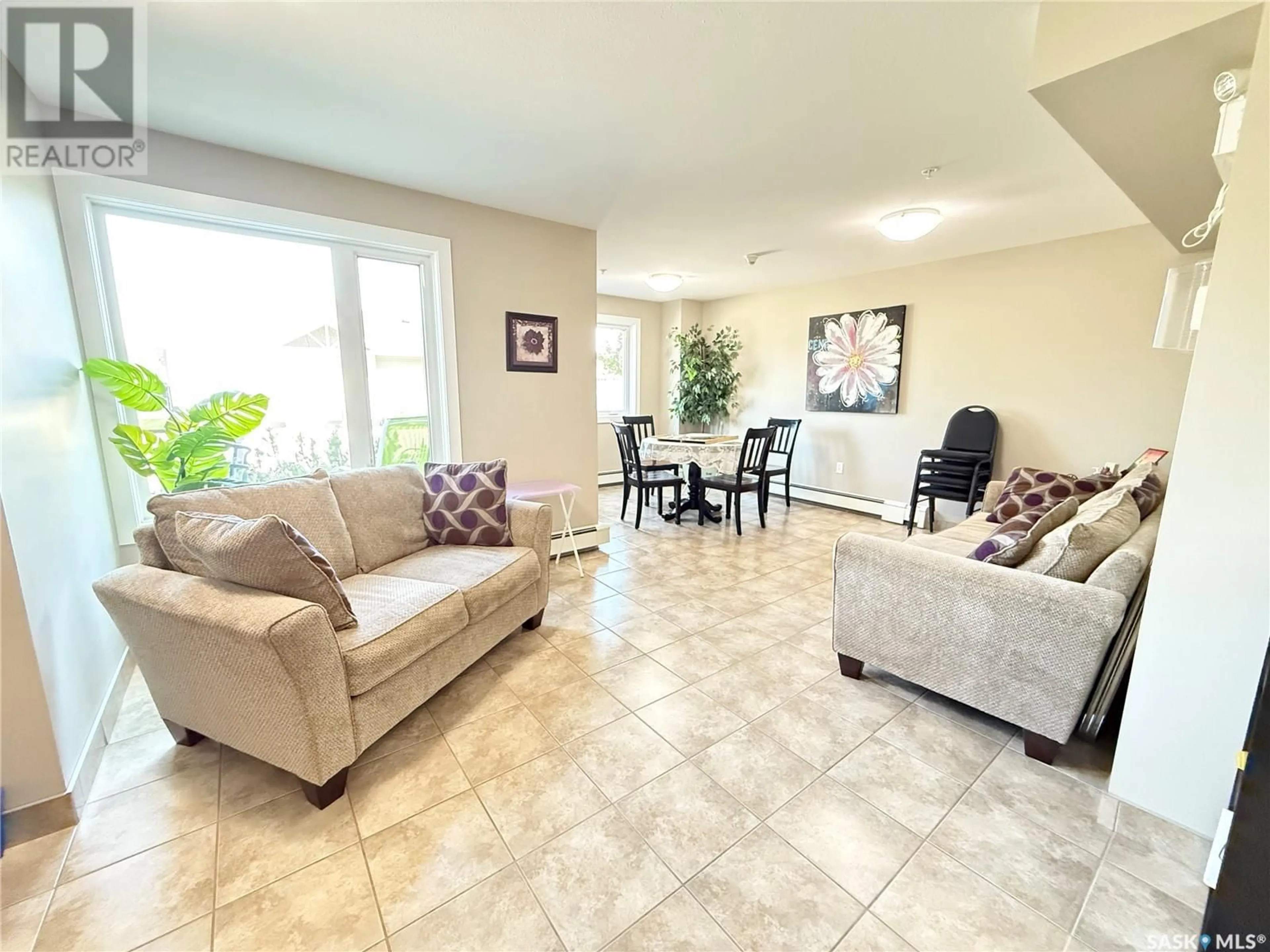 Living room with furniture, ceramic/tile floor for NE - 302 820 5TH STREET, Weyburn Saskatchewan S4H2V2