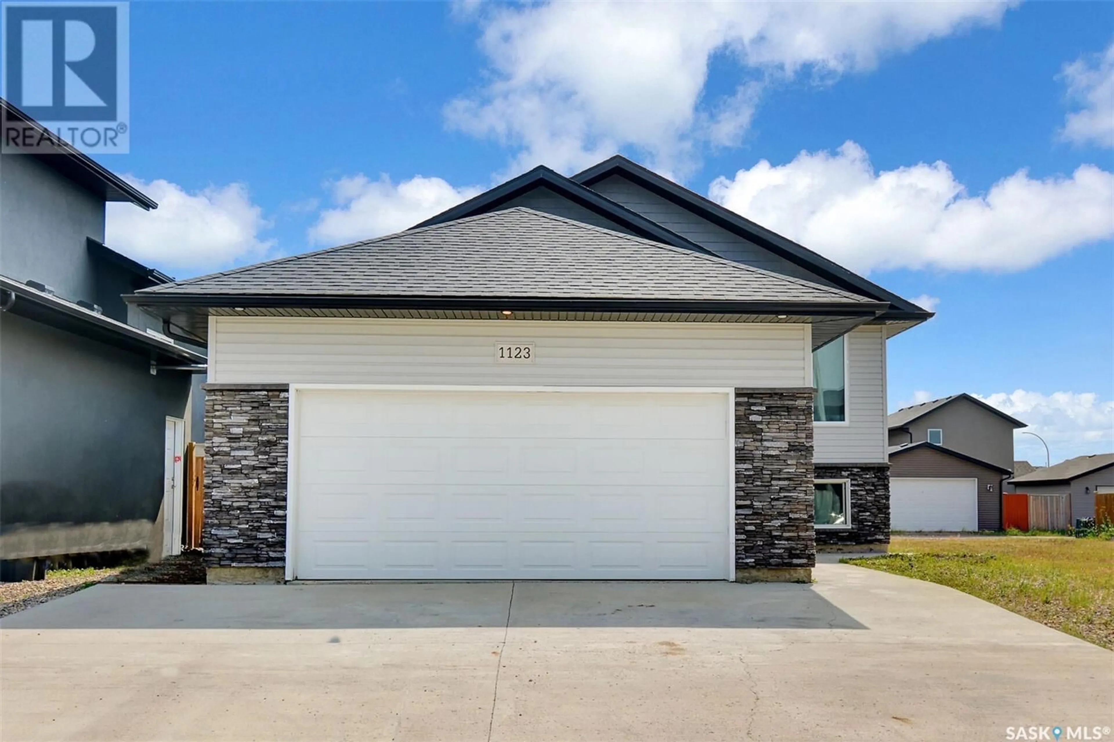 Home with vinyl exterior material, street for 1123 WERSCHNER CRESCENT, Saskatoon Saskatchewan S7V0A7